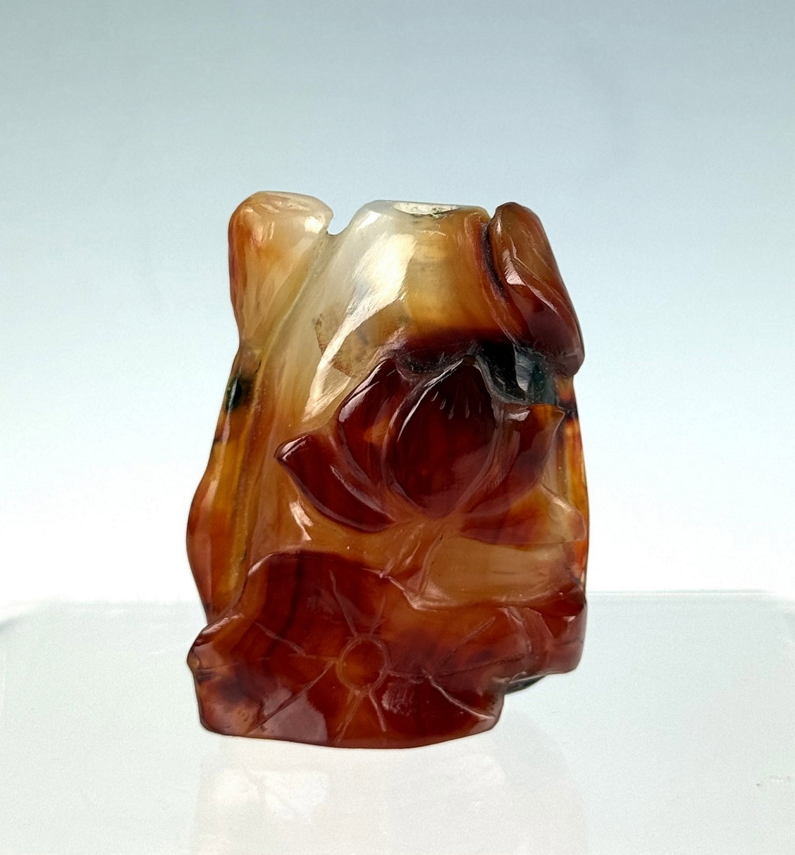 Chinese Carved Agate Snuff Bottle: Carved agate snuff bottle (no stopper). H 5 cm(2 in.). Preview from June 22nd to 26th from 1:00 PM TO 5:00 PM Eastern Time, Location: 15229 Display Court, Rockville, MD 20850.