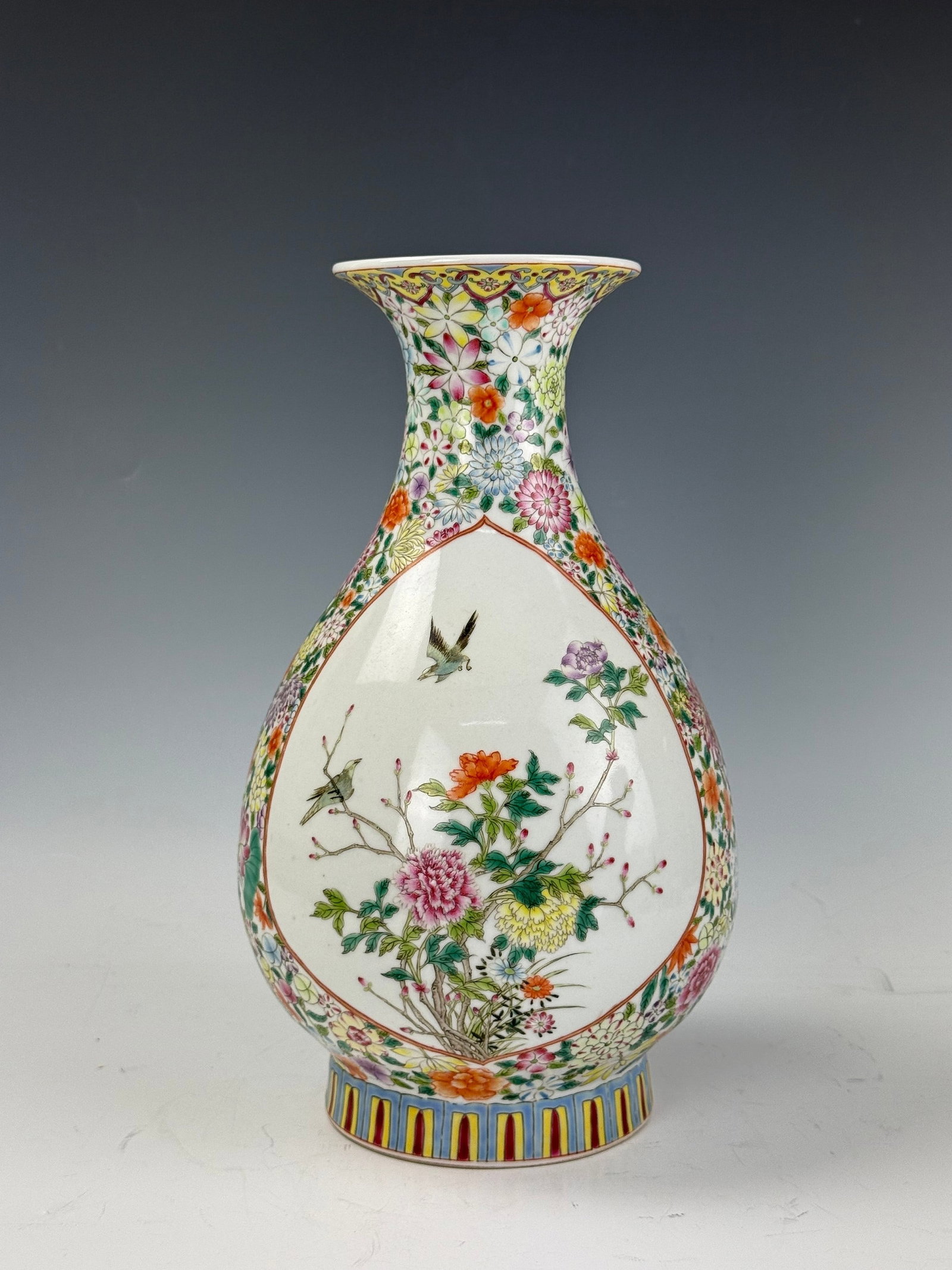 A Chinese Famille Rose Porcelain Vase Qianlong Mark: Famille rose vase with floral patterns and birds. Qianlong red seal mark. H 31cm(12.2in.) x D 16cm(6.3in.). Preview from June 22nd to 26th from 1:00 PM TO 5:00 PM Eastern Time, Location: 15229 Display