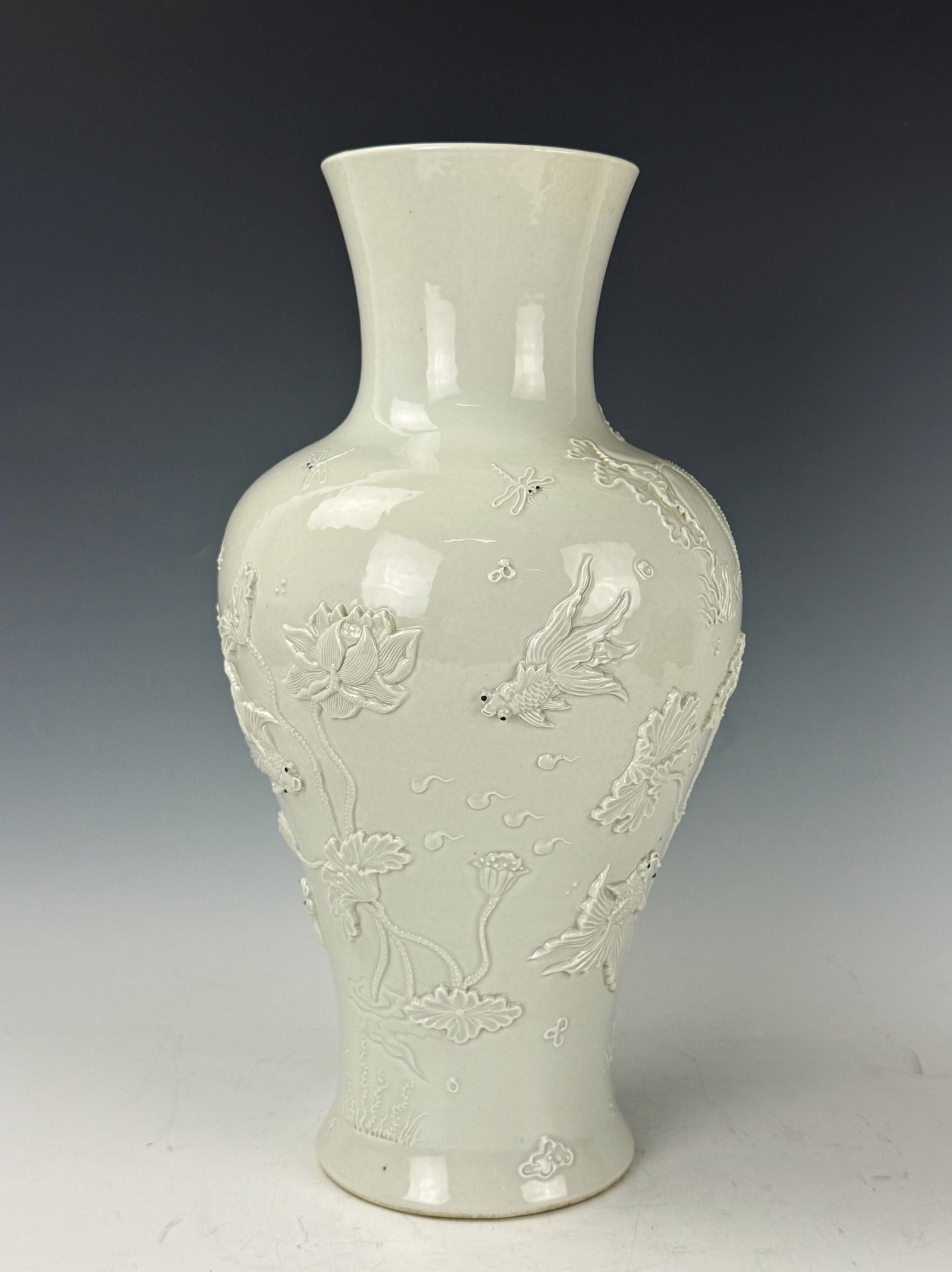 WangBingrong Mark White Porcelain Vase With Low Relief Goldfish and Lotus: Chinese White Porcelain Vase, WangBingrong Mark, With Low Relief Goldfish and Lotus Flowers. H 39cm (15.5in.). Preview from June 22nd to 26th from 1:00 PM TO 5:00 PM Eastern Time, Location: 15229 Disp