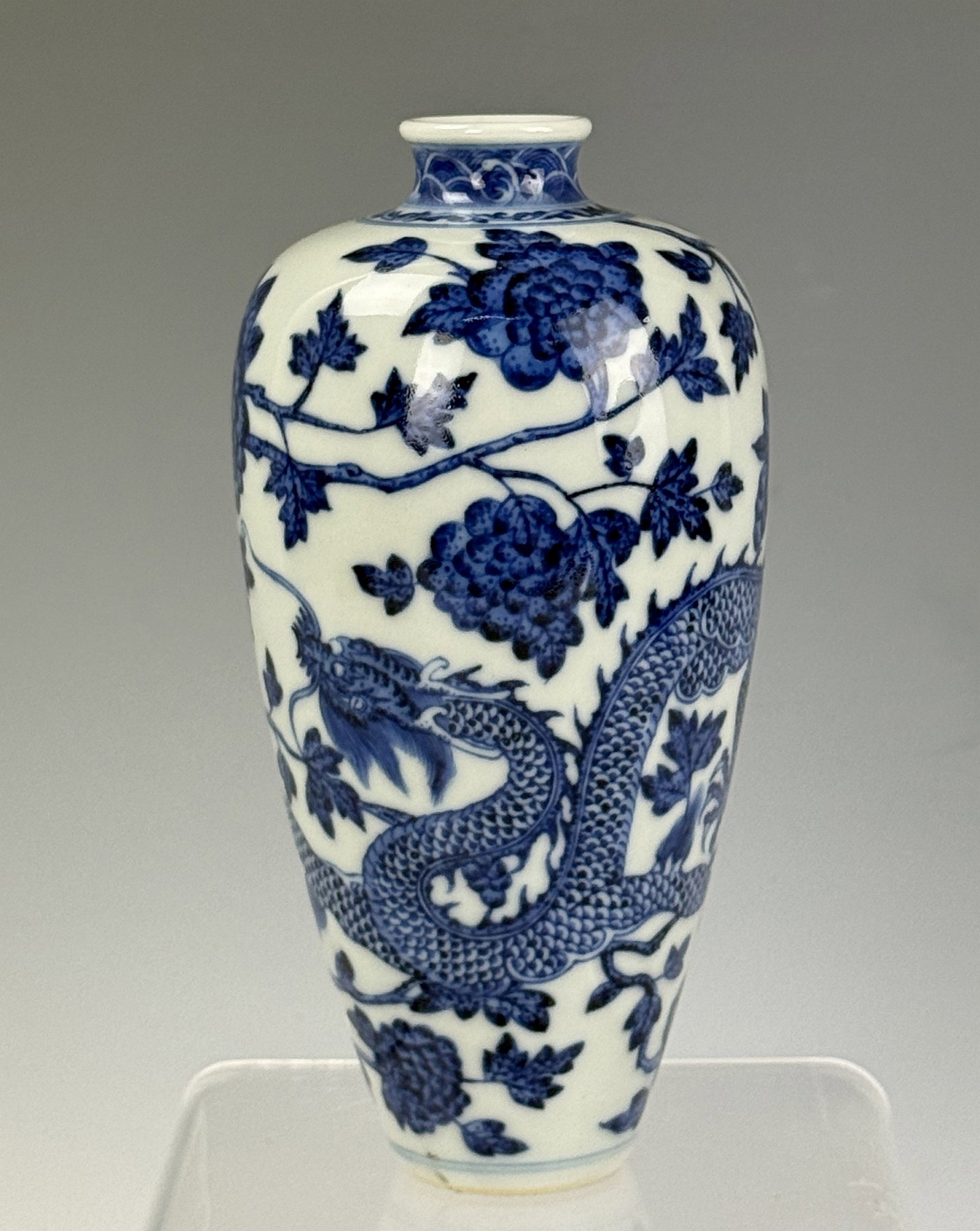 Chinese Blue and White Drogan Porcelain Vase Qianlong Mark: A slim porcelain vase painted with dragons among flowers. Qianlong mark. H 14.5cm(5.7in.) x D 7cm(2.8in.). Preview from June 22nd to 26th from 1:00 PM to 5:00 PM Eastern Time, Location: 15229 Display 