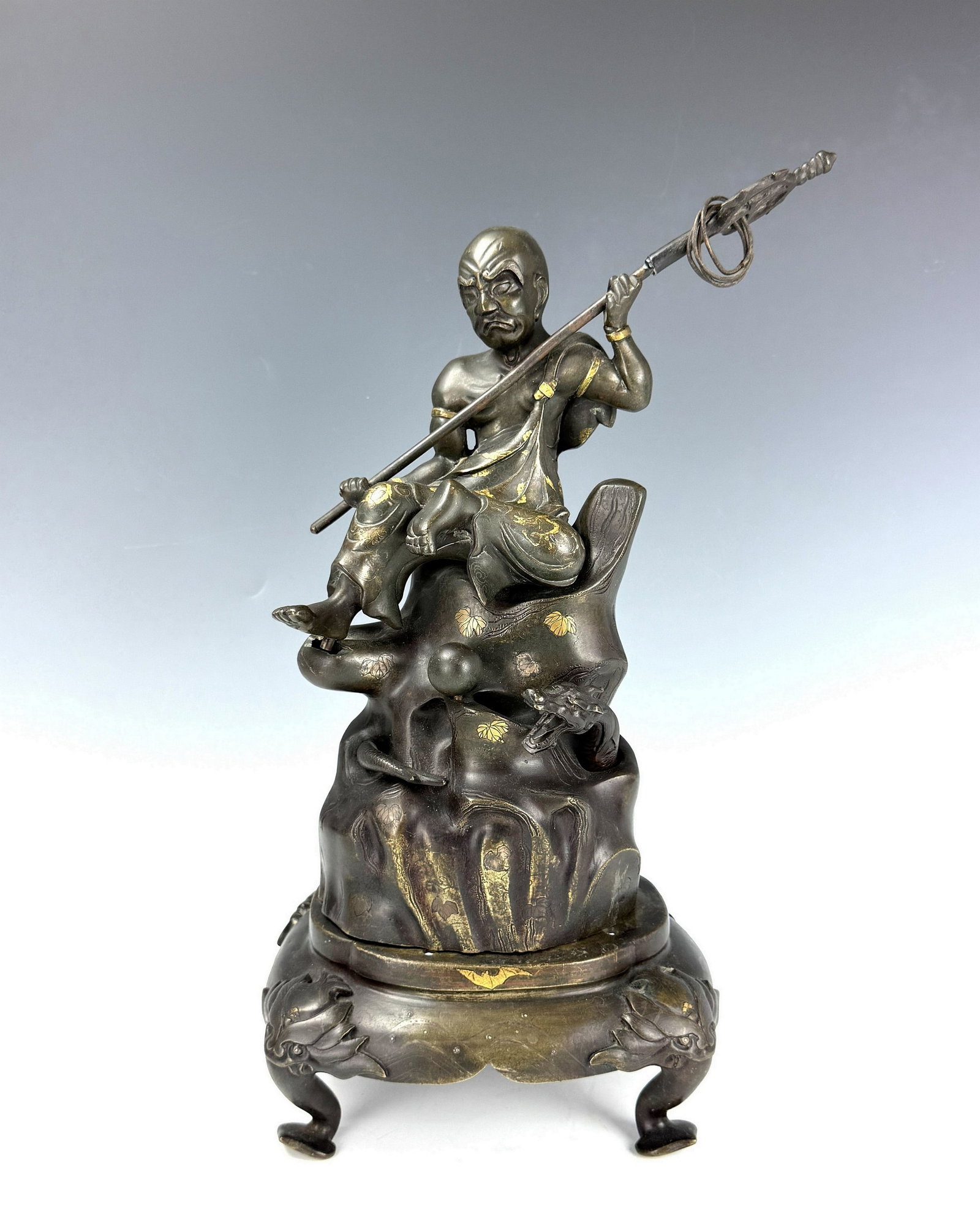 Fine Bronze Seated Figure with Staff on Decorative Base: Fine Bronze Seated Figure with Staff on Decorative Base. H 30cm(11.8in.) x W 22cm(8.7in.) x D 12cm(4.7 in.). Preview from June 22nd to 26th from 1:00 PM TO 5:00 PM Eastern Time, Location: 15229 Displa