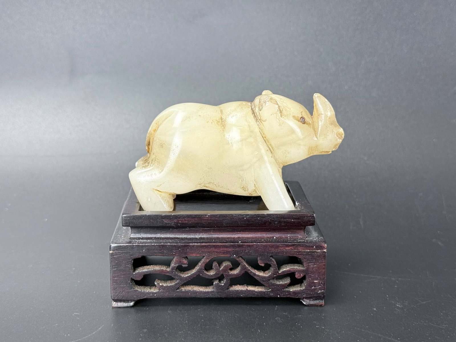An Antique Chinese Carved Jade Rhinoceros with Wood Base (1 of 5)
