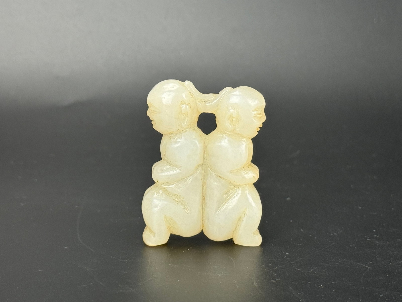 A Chinese Carved Jade Pendant Depicting Two Figures (1 of 2)
