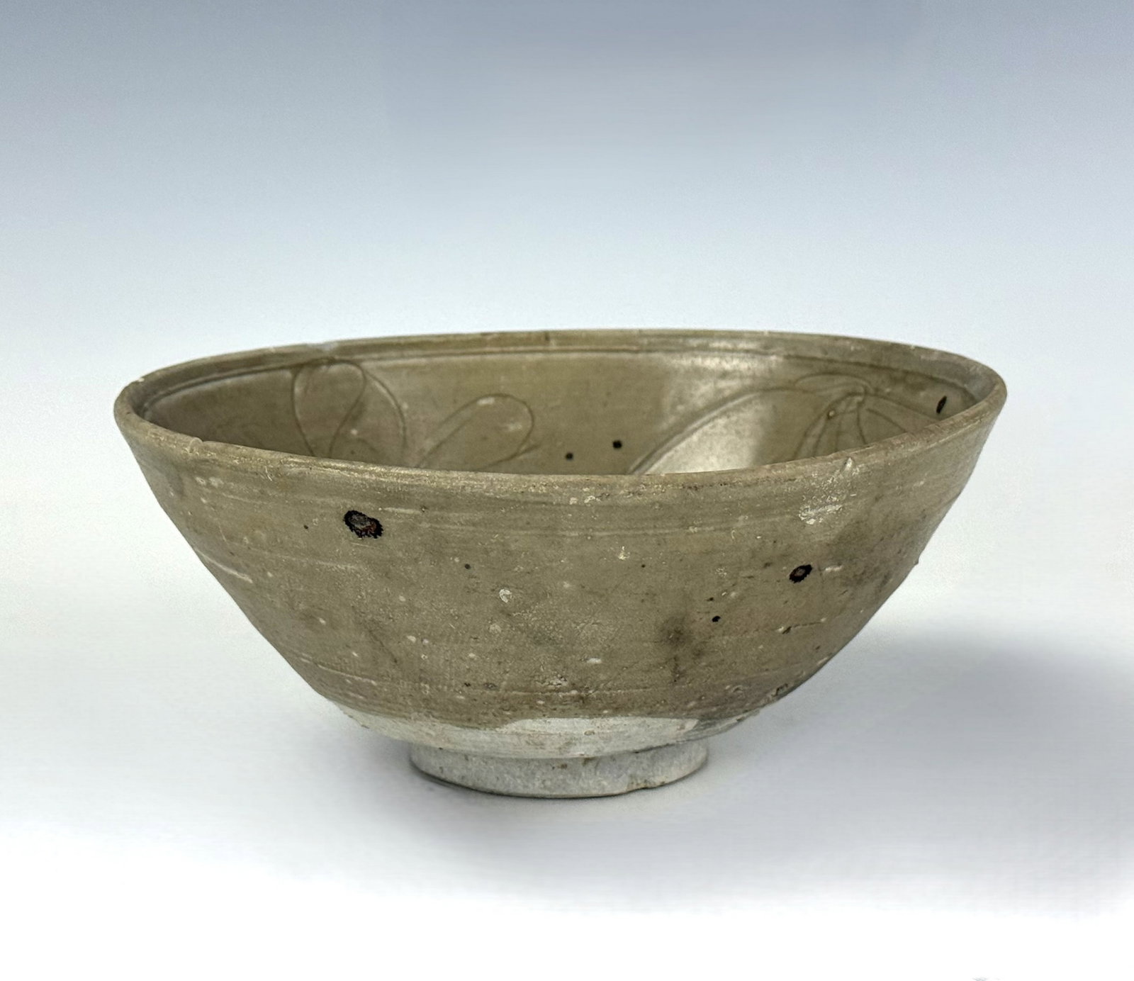 Chinese Song Dynasty Celadon Glazed Lotus Bowl: Celadon glazed lotus bowl with incised patterns of flowers, Northern Song. D 16.7cm(6.6 in.) x H 7.3cm(2.9in.). Preview from June 22nd to 26th from 1:00 PM TO 5:00 PM Eastern Time, Location: 15229 Dis