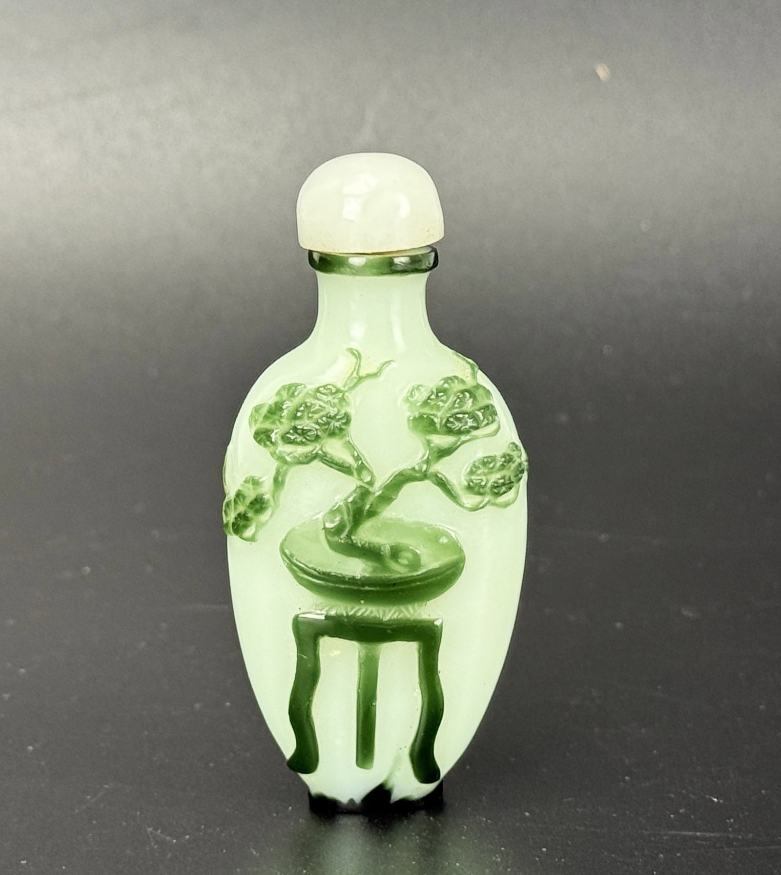 Chinese Green Overlay Glass Bonsai Snuff Bottle: Chinese Green Overlay Glass Bonsai Snuff Bottle. H 8.7cm(3.4 in.). Preview from June 22nd to 26th from 1:00 PM TO 5:00 PM Eastern Time, Location: 15229 Display Court, Rockville, MD 20850.