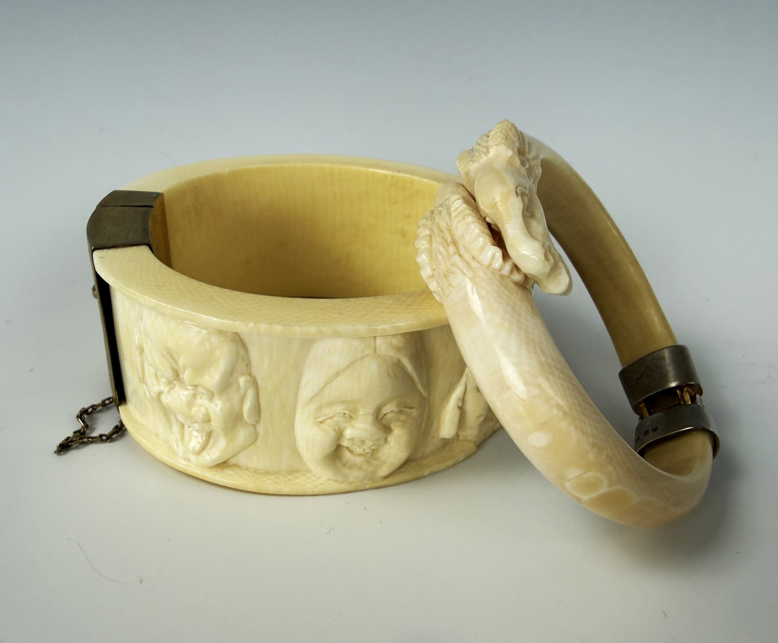 Set of Two Relief Cattle Bone Bracelets with Metal Clasps: Set of Two Relief Cattle Bone Bracelets with Metal Clasps.D 7.5 cm and D 6.6 cm. Preview from June 22nd to 26th from 1:00 PM TO 5:00 PM Eastern Time, Location: 15229 Display Court, Rockville, MD 20850