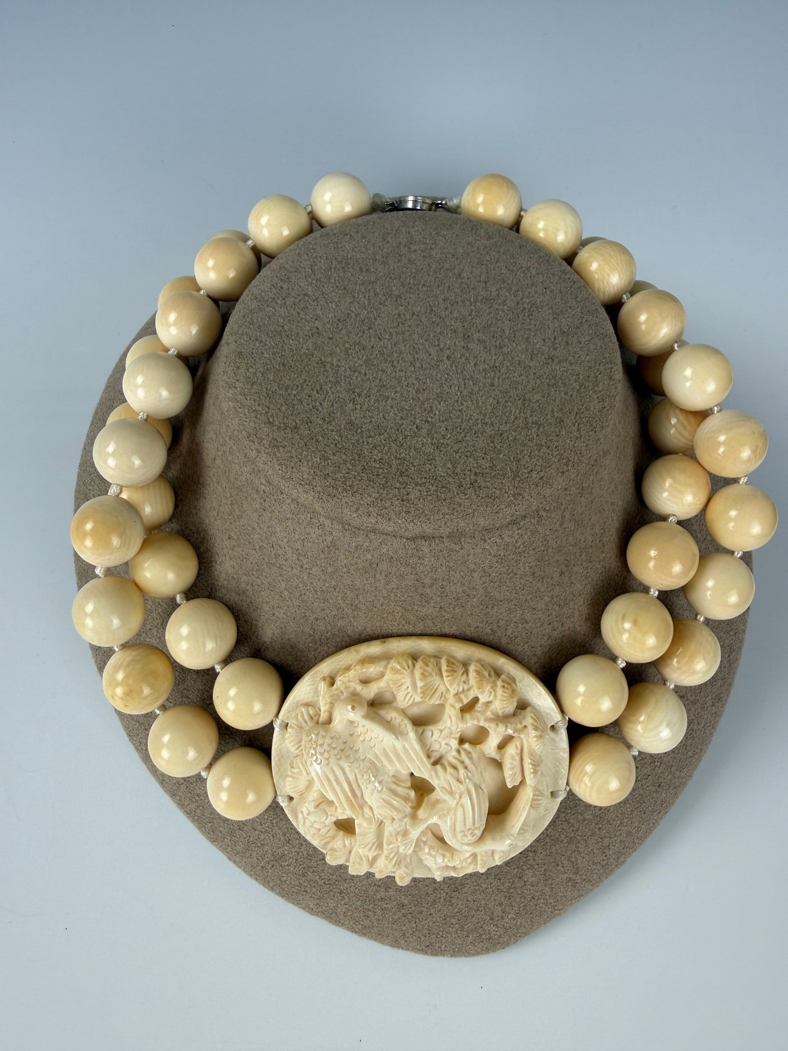 Vintage Double Strand Bead Necklace with Carved Bird Pendant: Vintage Double Strand Bead Necklace with Carved Bird Pendant. L 40 cm(16 in.).Preview from June 22nd to 26th from 1:00 PM TO 5:00 PM Eastern Time, Location: 15229 Display Court, Rockville, MD 20850.