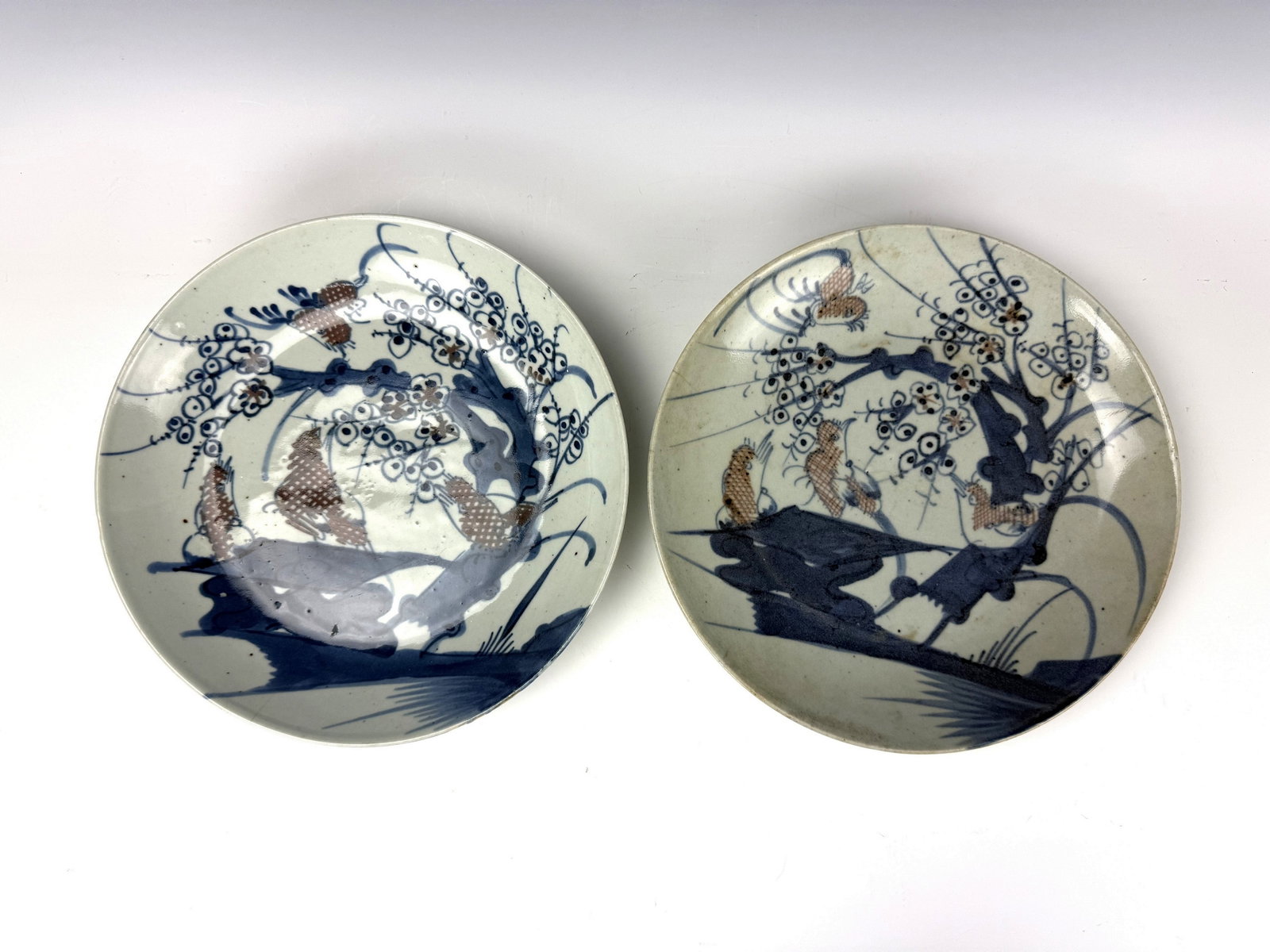 Pair of Chinese Underglaze Red and Blue Porcelain Plates 18TH Century: 18TH Century Chinese Blue and White Porcelain Plates With Underglaze Copper-red Accents. D 26cm(10.2in.) x 2. Preview from June 22nd to 26th from 1:00 PM TO 5:00 PM Eastern Time, Location: 15229