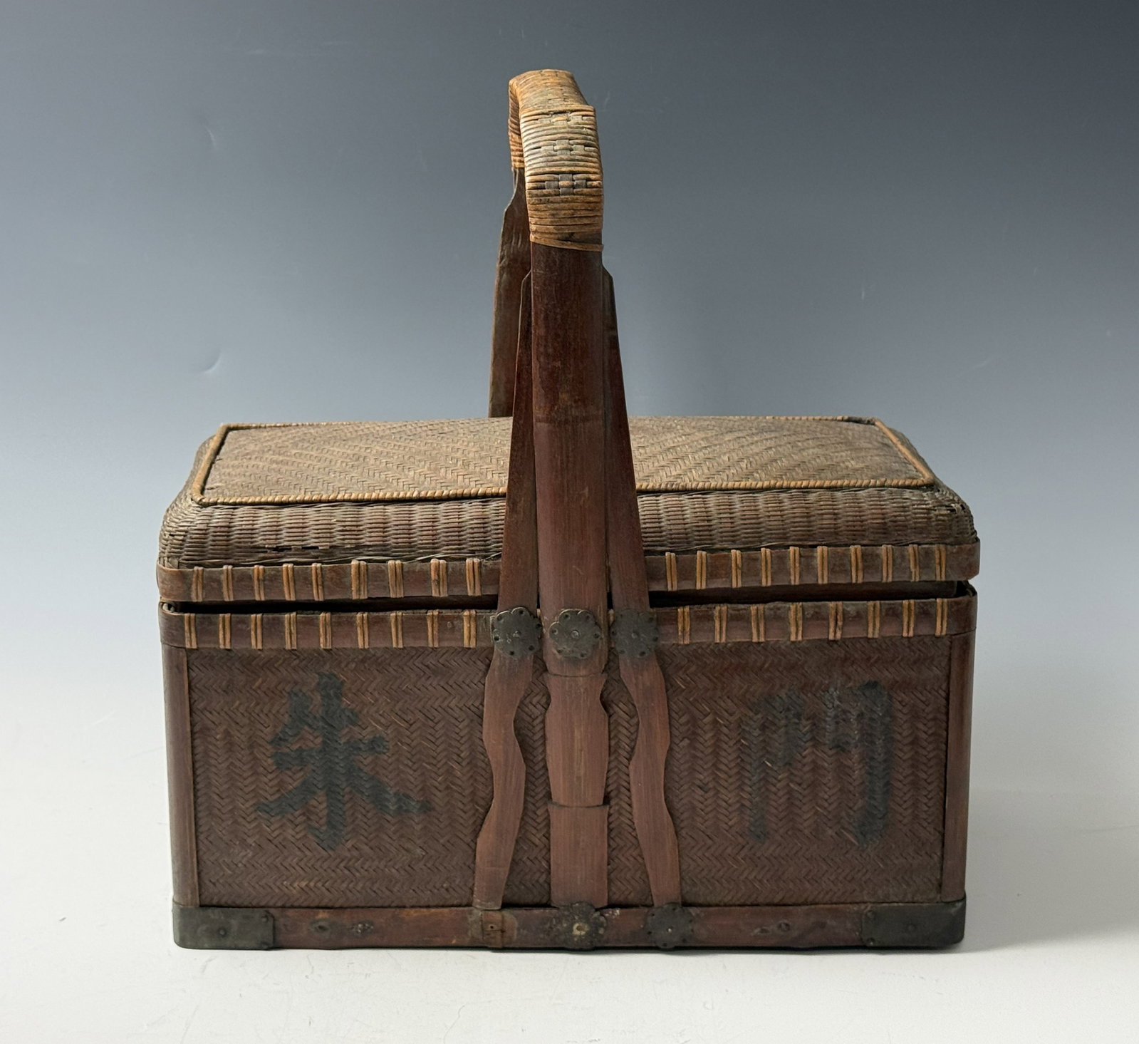 Antique Chinese Woven Bamboo Lunch Box with Handle: Antique Chinese Woven Bamboo Lunch Box with Handle. Handle H75cm(29.5in),body W38 (15 in)x H 23 (9 in)x D 20 (8 in). Preview from June 22nd to 26th from 1:00 PM TO 5:00 PM Eastern Time, Location: