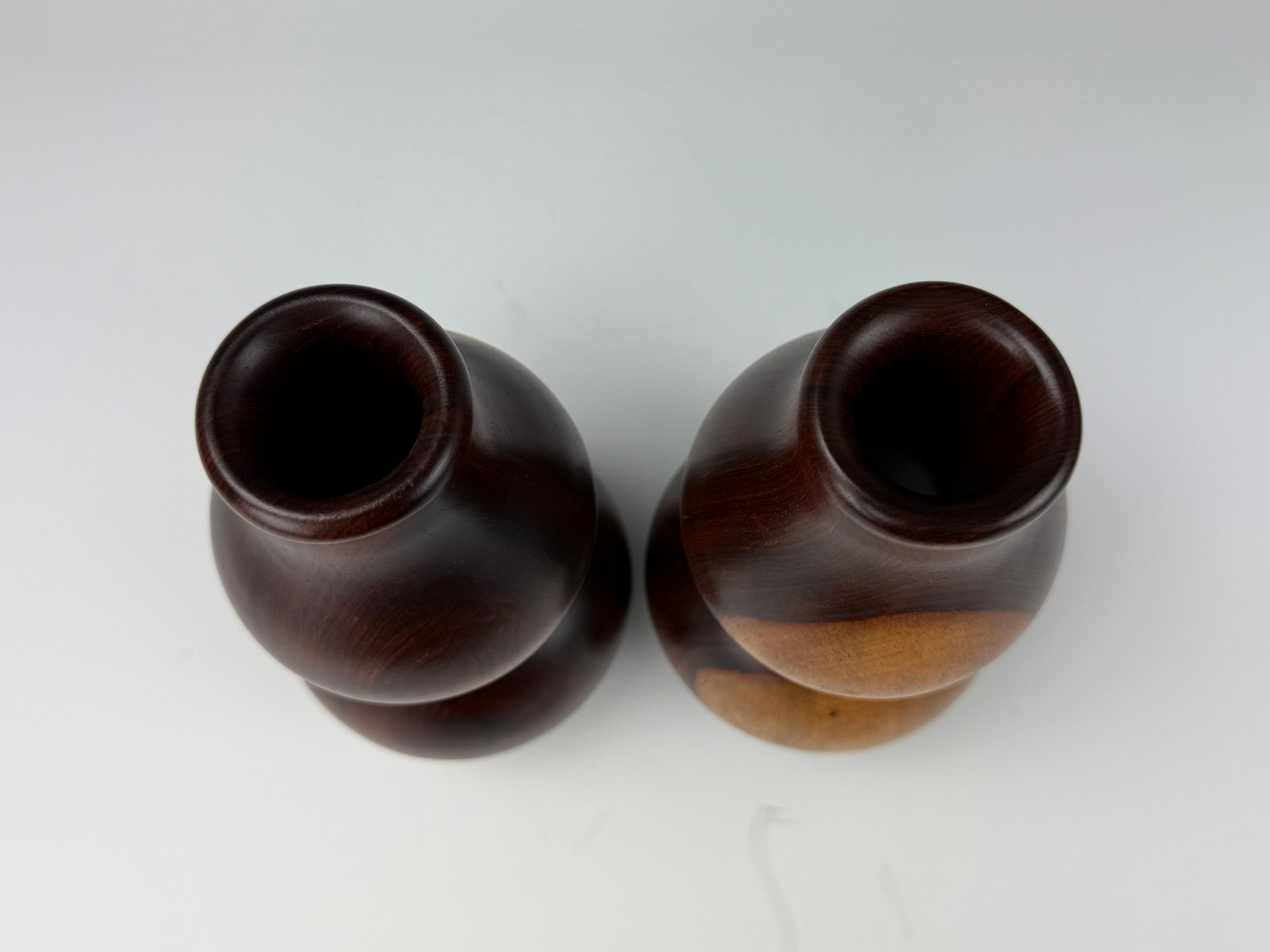 Pair of Wooden Double Gourd Vases: Pair of Wooden Double Gourd Vases. H 22.5cm (8.8in.) x D 4.8cm(1.8in.). Preview from Aug 24th to 28th from 1:00 PM TO 5:00 PM Eastern Time, Location: 15229 Display Court, Rockville, MD 20850.