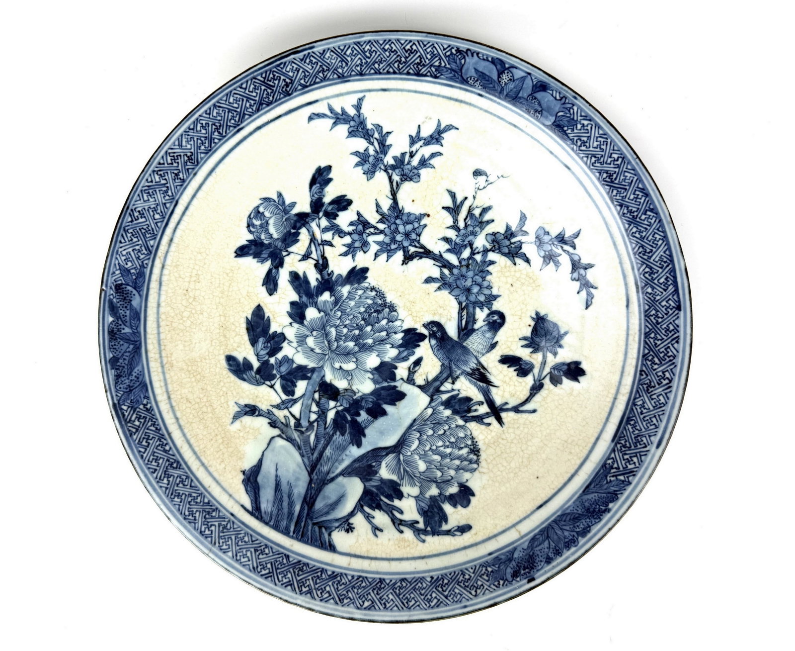 A Large Chinese Blue and White Porcelain Plate: Chinese Blue and White Porcelain Plate with Bamboo Leaf Rim and Crackle Glaze. D 37.2 cm(14.6 in.) x H 4.8 cm(1.9 in.). Preview from Aug 24th to 28th from 1:00 PM TO 5:00 PM Eastern Time, Location: 15