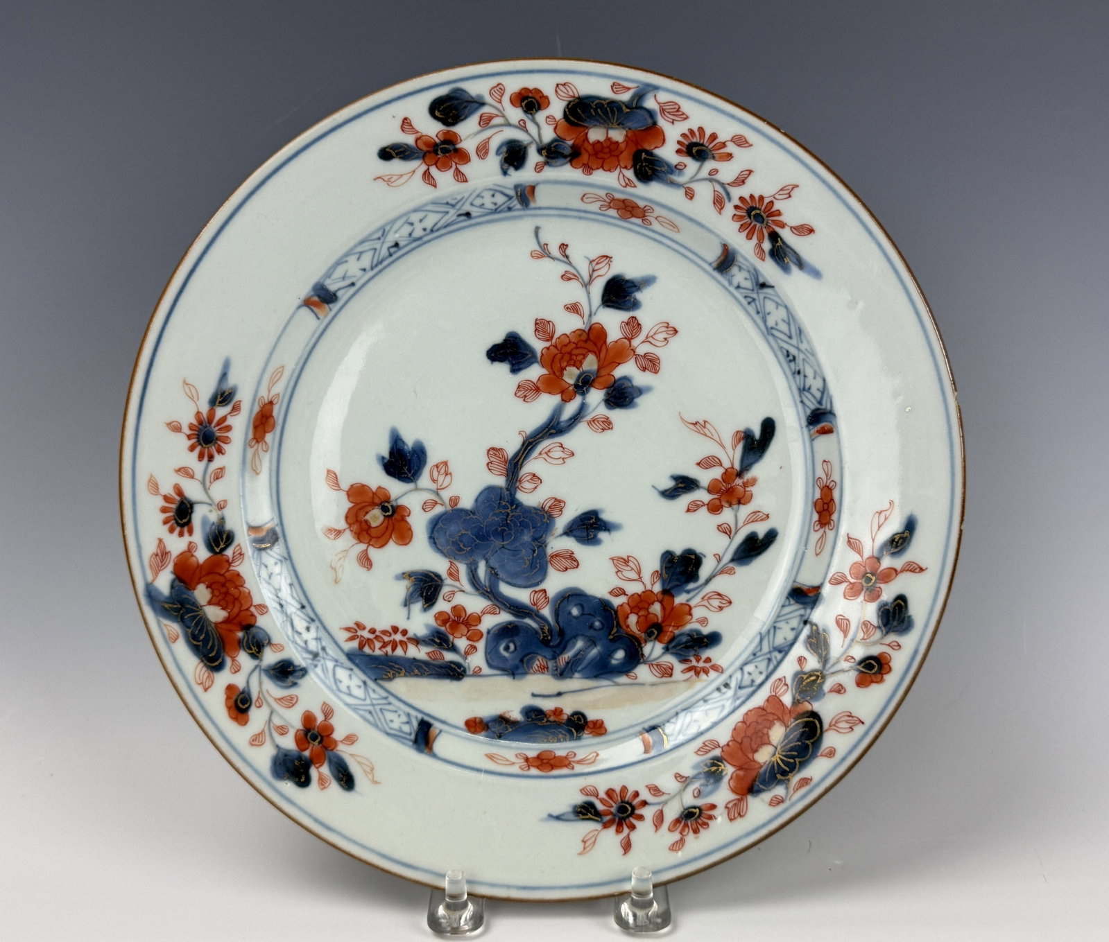 Asian Antique Porcelain Plate Featuring Red and Blue Floral Design: Asian Antique Porcelain Plate Featuring Red and Blue Floral Design. D 23 cm(9.1 in.),Preview from Aug 24th to 28th from 1:00 PM TO 5:00 PM Eastern Time, Location: 15229 Display Court, Rockville, MD 20