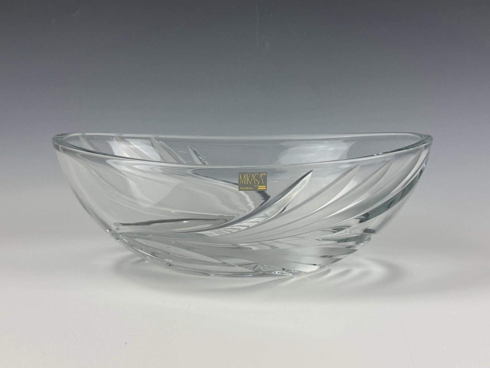 A Mikasa Slovenia Crystal Oval Bowl: Mikasa Slovenia Crystal Oval Bowl. L 32.5 cm(12.8 in.) x W 19.3 cm(7.6 in.) x H 11 cm(4.3 in.). Preview from Aug 24th to 28th from 1:00 PM TO 5:00 PM Eastern Time, Location: 15229 Display Court, Rockv