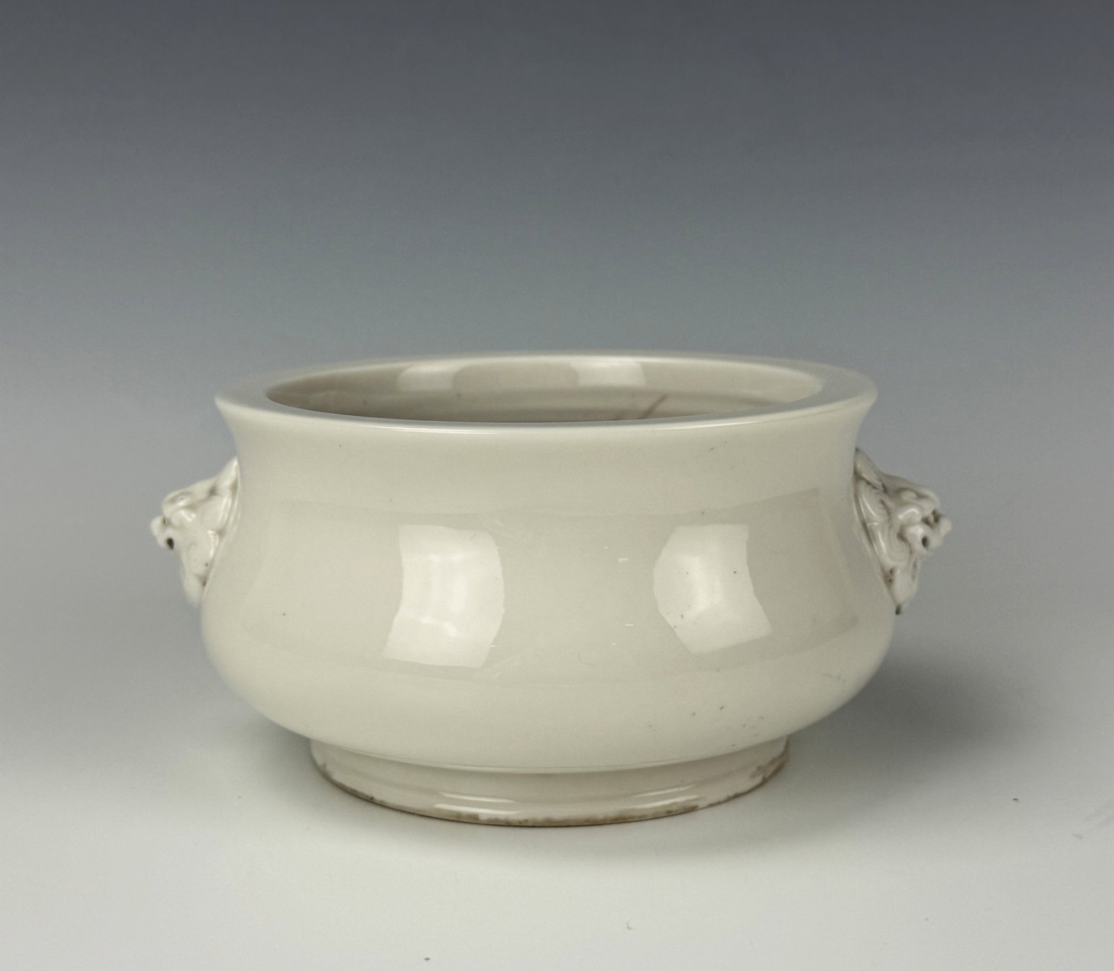Dehua Kiln Blanc de Chine Incense Burner Xuande Mark: Dehua Kiln "Blanc de Chine" Incense Burner With Double Lion Ears Xuande Mark. D 12.3 cm(4.8 in.) x H 7.4 cm(2.9 in.). Preview from Aug 24th to 28th from 1:00 PM TO 5:00 PM Eastern Time, Location: 1522