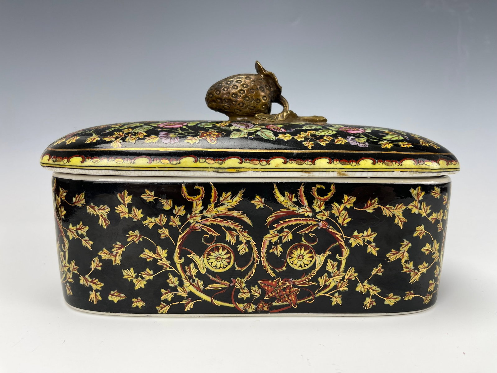 A Chinoiserie Earthenware Trinket Box With Brass Strawberry Shaped Finial: Circa 1965/1975 Chinoiserie Earthenware Trinket Box With Brass Strawberry-Shaped Finial, Hong Kong.size W 21 cm(8.3in.)x D 9.5 cm(3.8 in.) x H12 cm(5 in.). Preview from Aug 24th to 28th from 1:00 PM T