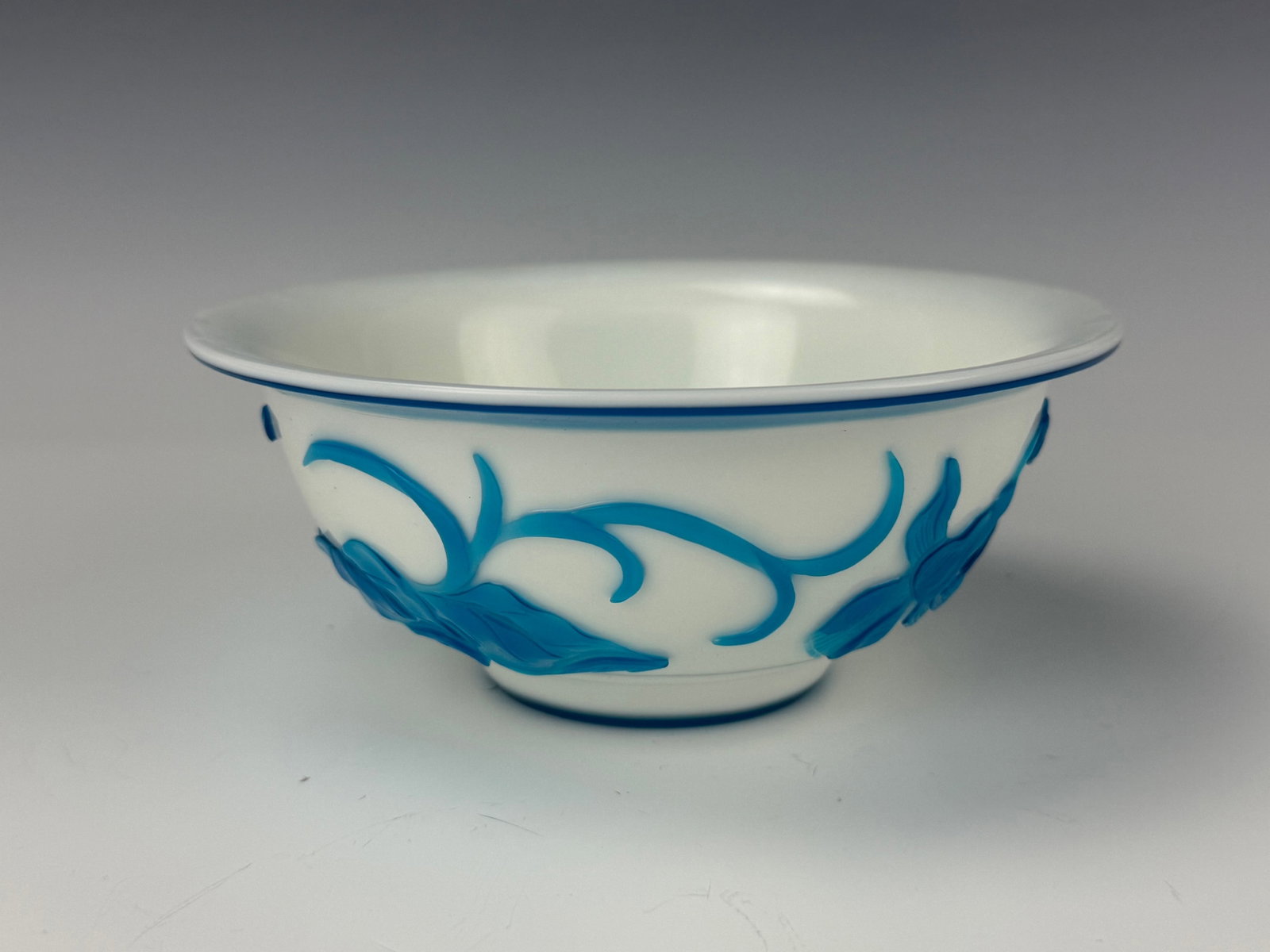 Chinese Peking Glass Bowl With Sky Blue Overlay of Flowers: Peking Glass Bowl With Sky Blue Overlay of Flowers. D 15.2 cm(6 in.) x H 6.2 cm(2.4 in.). Preview from Aug 24th to 28th from 1:00 PM TO 5:00 PM Eastern Time, Location: 15229 Display Court, Rockville, 