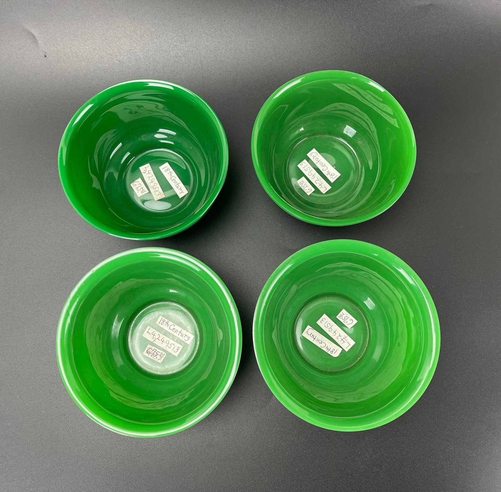 Four Antique Chinese Green Peking Glass Bowls: Four Antique Chinese Green Peking Glass Bowls. D 11 cm(4.5 in.) x H 6 cm(2.5 in.) x 4. Preview from Aug 24th to 28th from 1:00 PM TO 5:00 PM Eastern Time, Location: 15229 Display Court, Rockville, MD 