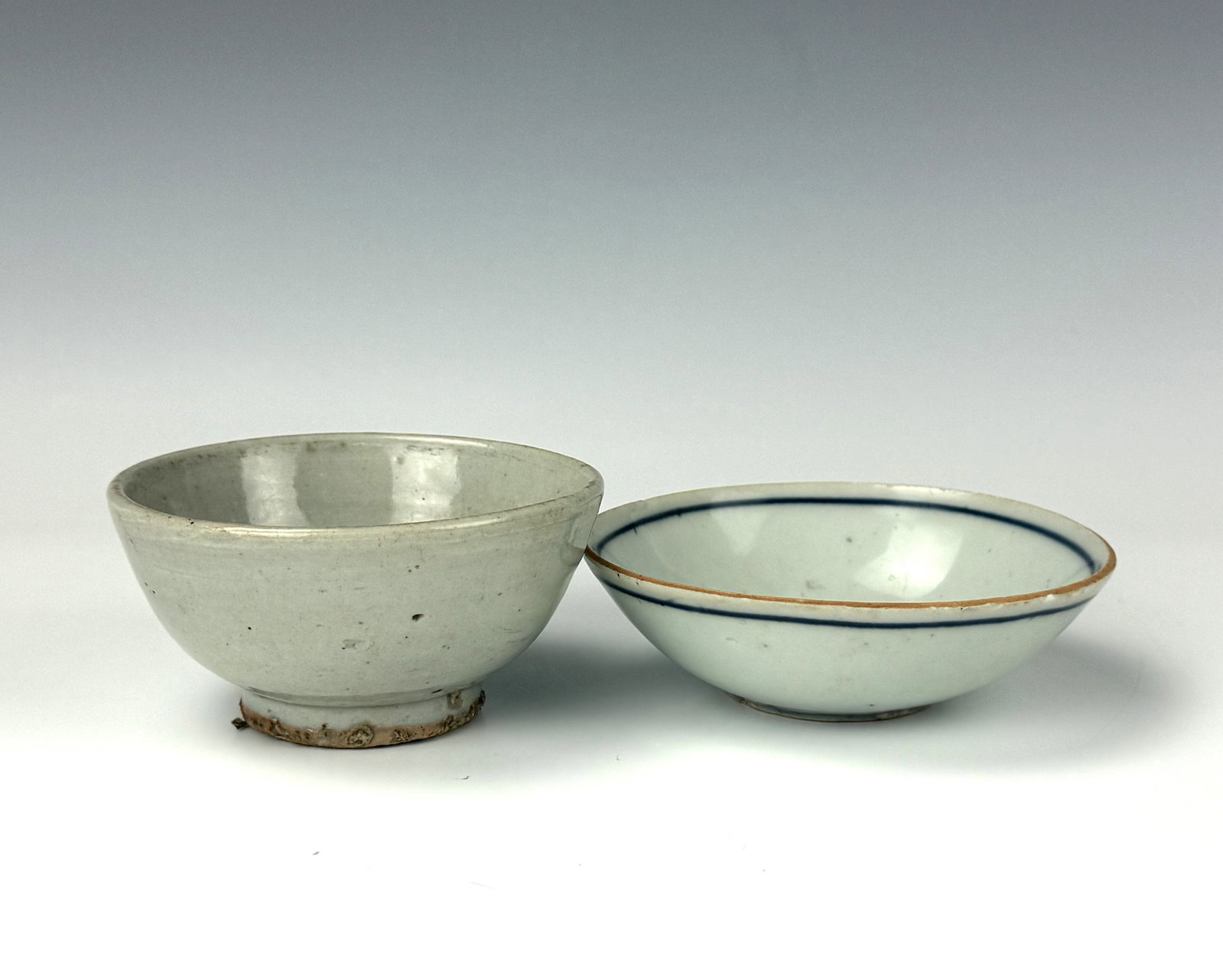 Two Antique Chinese Porcelain Bowls: Chinese Ming Dynasty Stoneware Bowl and Blue and white Longevity character bowl. D 10 cm(4 in.) x H 5 cm(2 in.) and D 11.6 cm(4.6 in.) x H 3.5 cm(1.4 in.). Preview from Aug 24th to 28th from 1:00 PM T