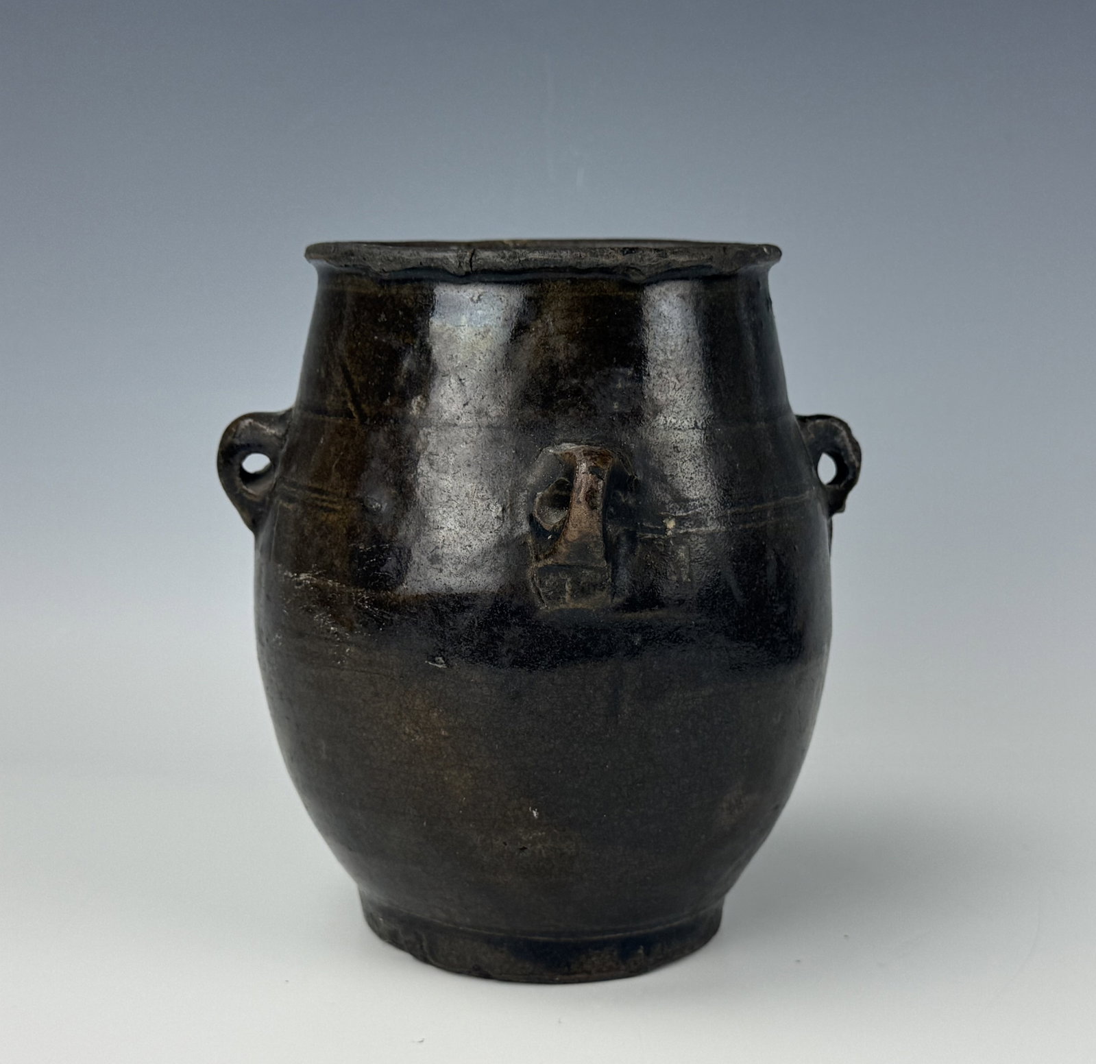 Antique Chinese Stoneware Black Glazed Jar With 4 Handles: Antique Chinese Stoneware Black Glazed Jar With 4 Handles. H 17.3 cm(6.8 in.) x D 10.6 cm(4.2 in.). Preview from Aug 24th to 28th from 1:00 PM TO 5:00 PM Eastern Time, Location: 15229 Display Court, R