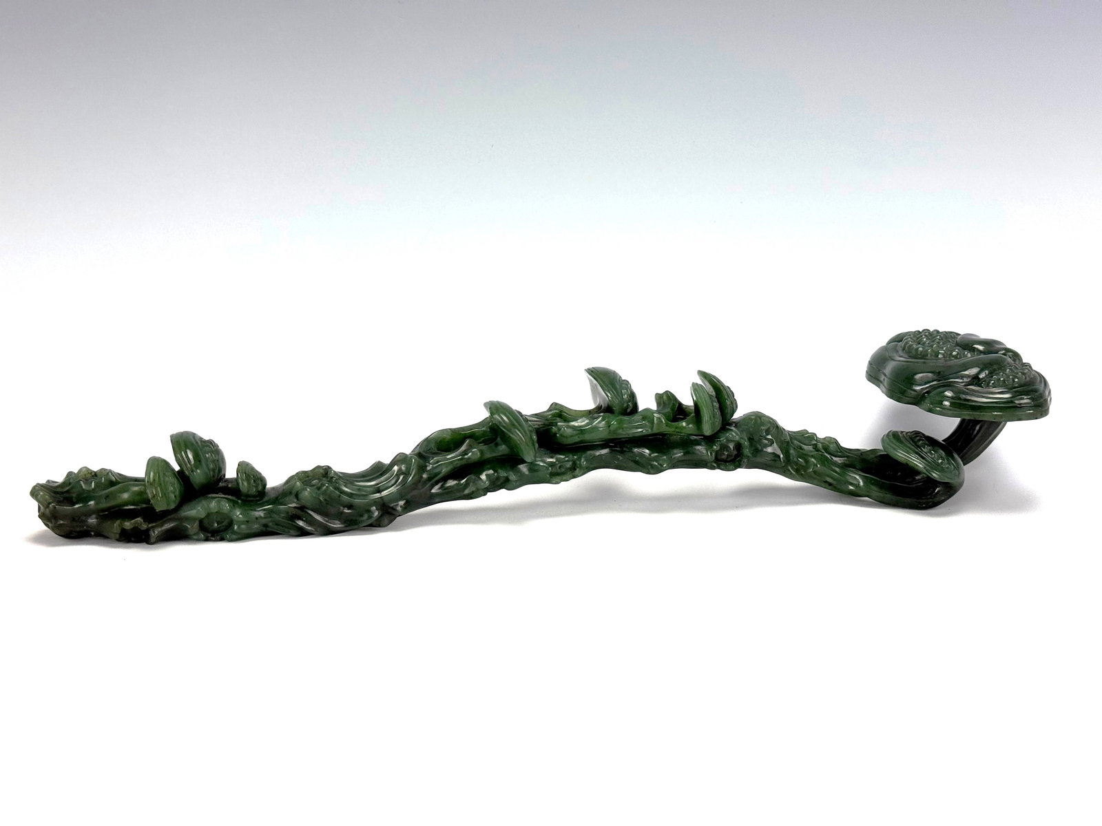 A Green Hetian Nephrite Lingzhi Form Ruyi Scepter (1 of 7)