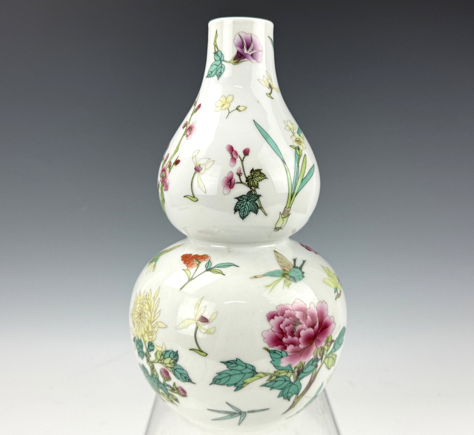 A Chinese Famille Rose Porcelain Double Gourd Vase: A Chinese Famille Rose Porcelain Double Gourd Vase. H 26.5 cm(10.4 in.). Preview from Aug 24th to 28th from 1:00 PM TO 5:00 PM Eastern Time, Location: 15229 Display Court, Rockville, MD 20850.
