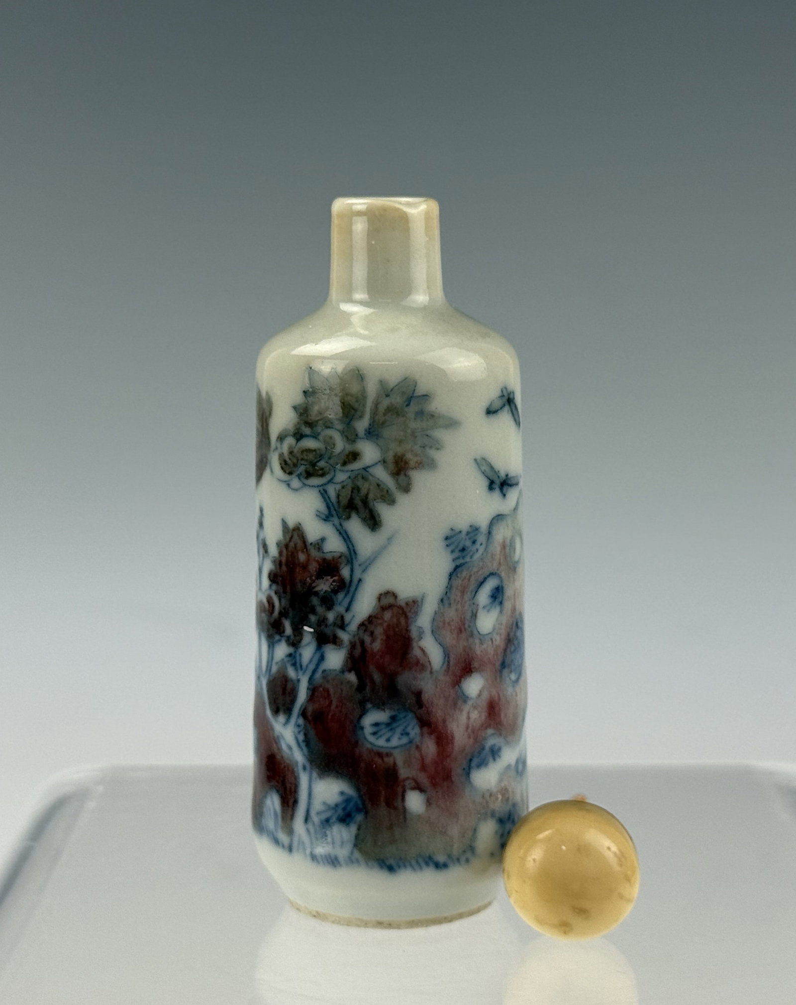 Chinese Under Glaze Red Porcelain Snuff Bottle: Porcelain Snuff Bottle with Red and Blue Enamel Landscape Decoration. H 8.5 cm(3.3 in.). Preview from Aug 24th to 28th from 1:00 PM TO 5:00 PM Eastern Time, Location: 15229 Display Court, Rockville, M