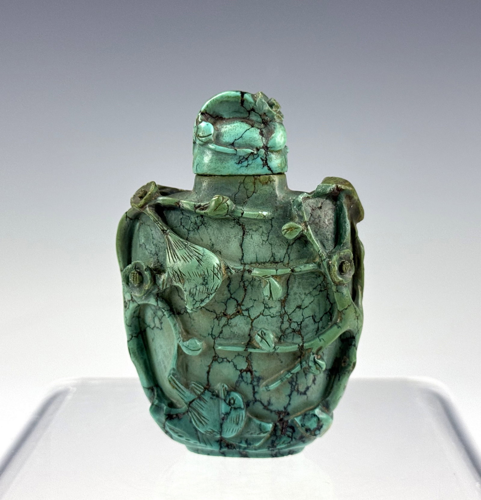 Chinese Turquoise Carved Snuff Bottle with Floral and Figural Motifs (1 of 5)