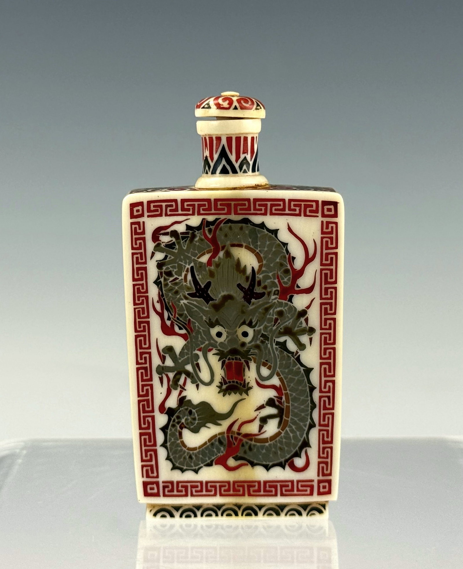 Chinese Rectangular Red Dragon Design Snuff Bottle with Qianlong Mark: Chinese Rectangular Snuff Bottle, Qianlong Mark,with Gray and Red Dragon Design and Matching Stopper. H 7 cm(2.8 in.). Preview from Aug 24th to 28th from 1:00 PM TO 5:00 PM Eastern Time, Location: 152