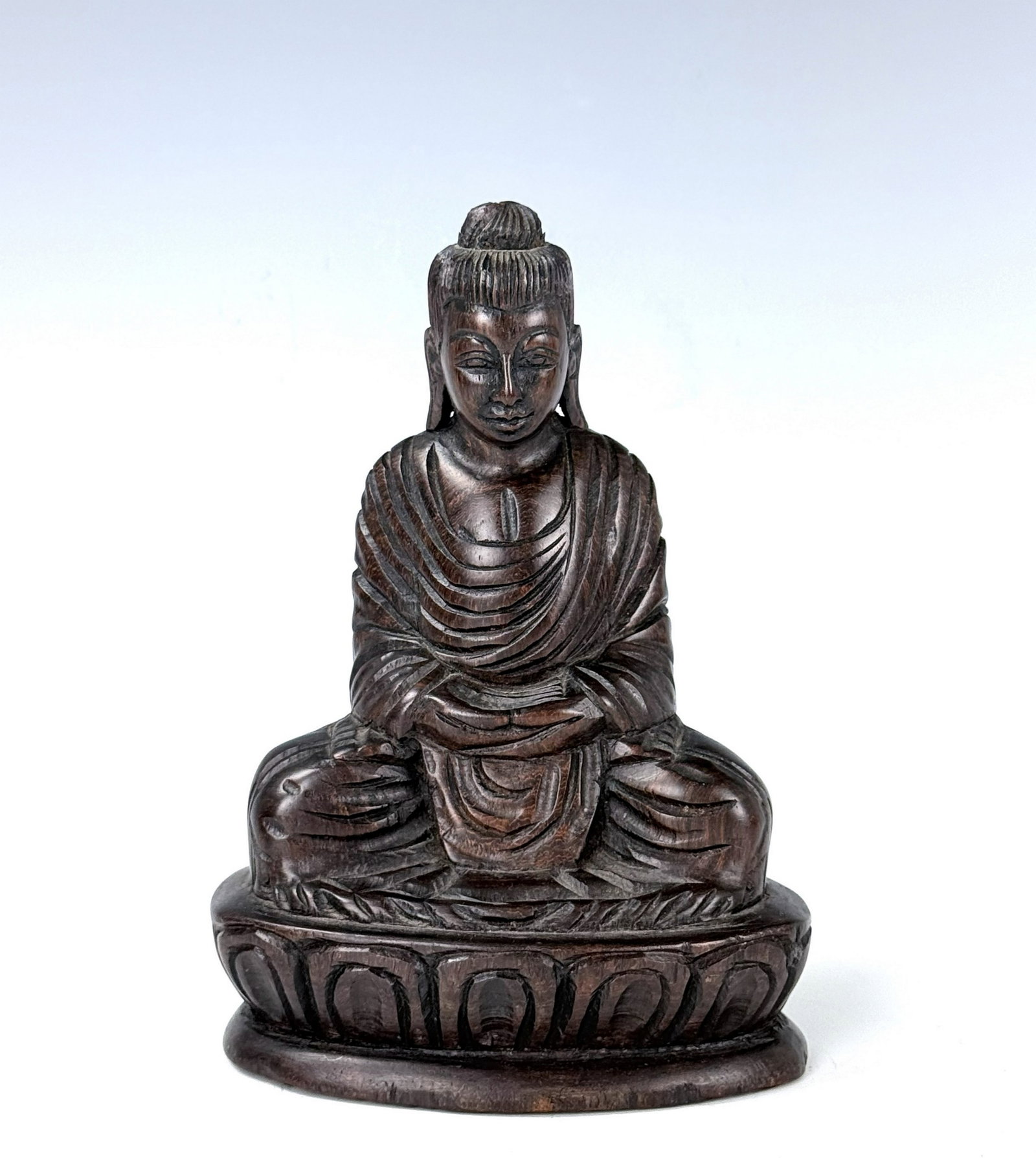 Vintage Carved Wooden Seated Buddha on Lotus Base: Vintage Carved Wooden Seated Buddha on Lotus Base. H 17.8 cm(7 in.). Preview from Aug 24th to 28th from 1:00 PM TO 5:00 PM Eastern Time, Location: 15229 Display Court, Rockville, MD 20850.