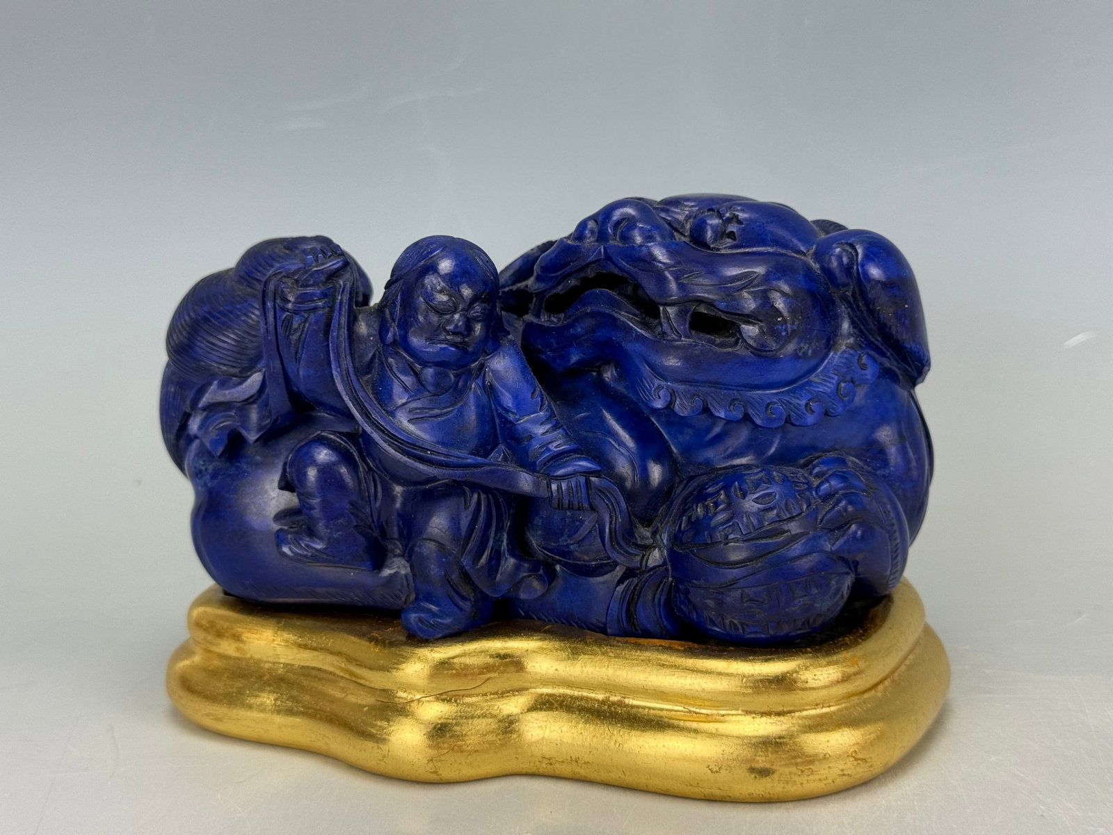 Chinese Carved Lapis lazuli Figurine of A Man Playing with A Lion: Chinese Carved Lapis lazuli Figurine of A Man Playing with A Lion,Size 13 x 7 x 6.8 cm.Preview from Aug 24th to 28th from 1:00 PM TO 5:00 PM Eastern Time, Location: 15229 Display Court, Rockville, MD 