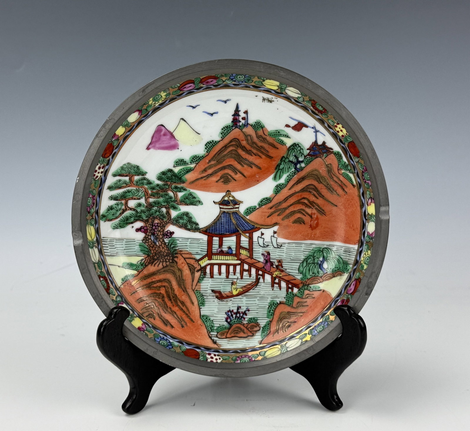 Vintage Chinese Porcelain Plate Encasement Pewter with Wood Stand: Vintage Chinese Porcelain Plate Encasement Pewter with Wood Stand. D 9.2 cm(3.6 in.). Preview from Aug 24th to 28th from 1:00 PM TO 5:00 PM Eastern Time, Location: 15229 Display Court, Rockville, MD 2