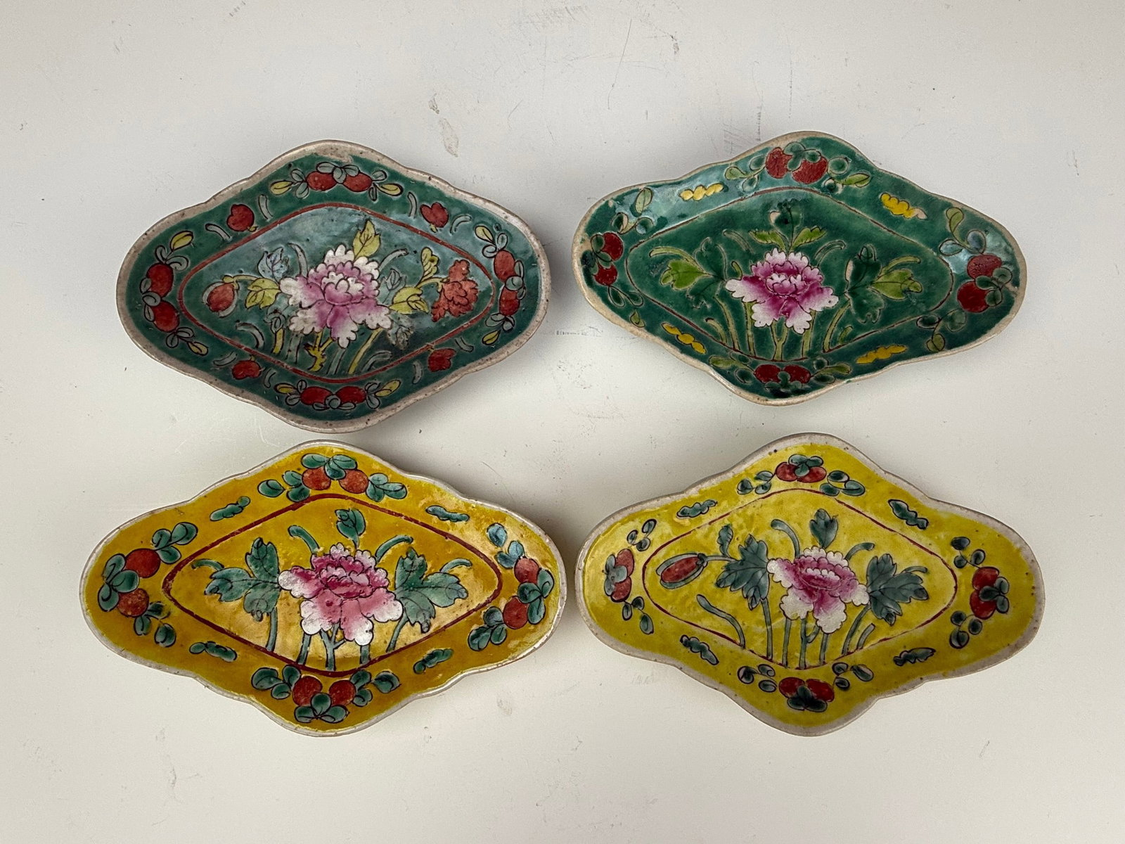 Four Antique Chinese Peranakan Nyonya Famille Rose Footed Sweetmeat Dishes: Four Antique Chinese Peranakan Nyonya Famille Rose Lobed Footed Sweetmeat Dishes. W 18.6 cm(7.3 in.) x H 2.5 cm(1 in.). Preview from Aug 24th to 28th from 1:00 PM TO 5:00 PM Eastern Time, Location: 15