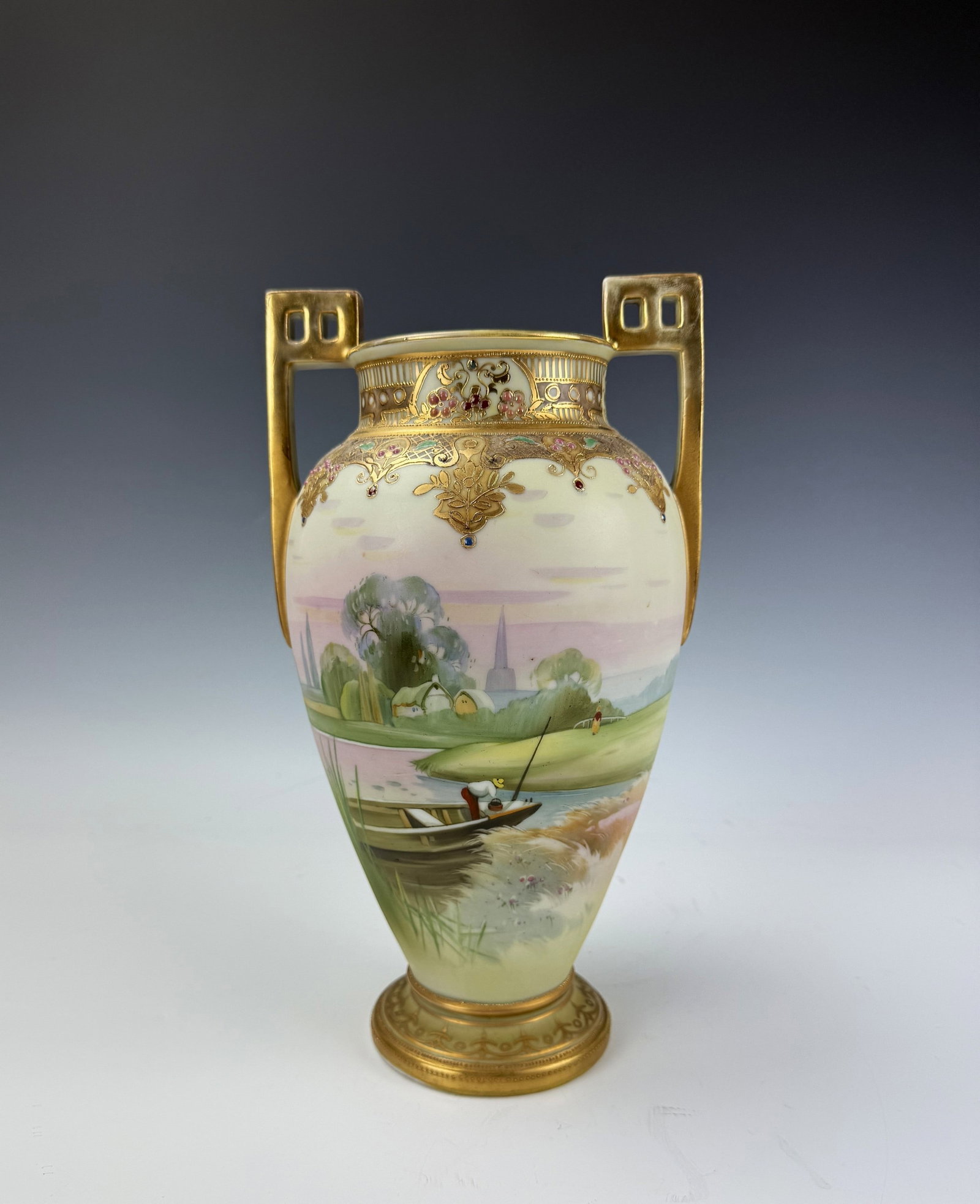 Antique Nippon Porcelain Urn Twin Handle Landscape River Vase Gilt: Antique Nippon Hand Painted Porcelain Twin Handle Landscape River Urn Vase Gilt. H 31 cm(12.2 in.). Preview from Aug 24th to 28th from 1:00 PM TO 5:00 PM Eastern Time, Location: 15229 Display Court, R