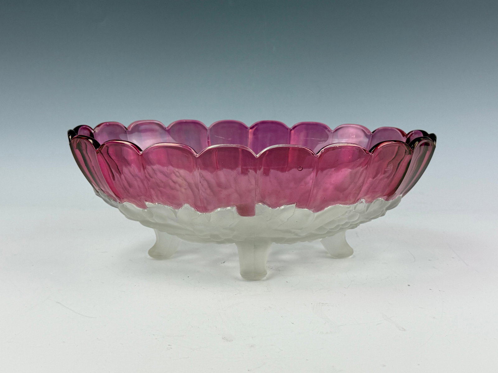 Pink to Clear Scalloped Art Glass Bowl with Embossed Fruit and Leaf Motif: Pink to Clear Scalloped Art Glass Bowl with Embossed Fruit and Leaf Motif. D 30.5 cm(12 in.) x H 11.2 cm(4.4 in.). Preview from Aug 24th to 28th from 1:00 PM TO 5:00 PM Eastern Time, Location: 15229 D