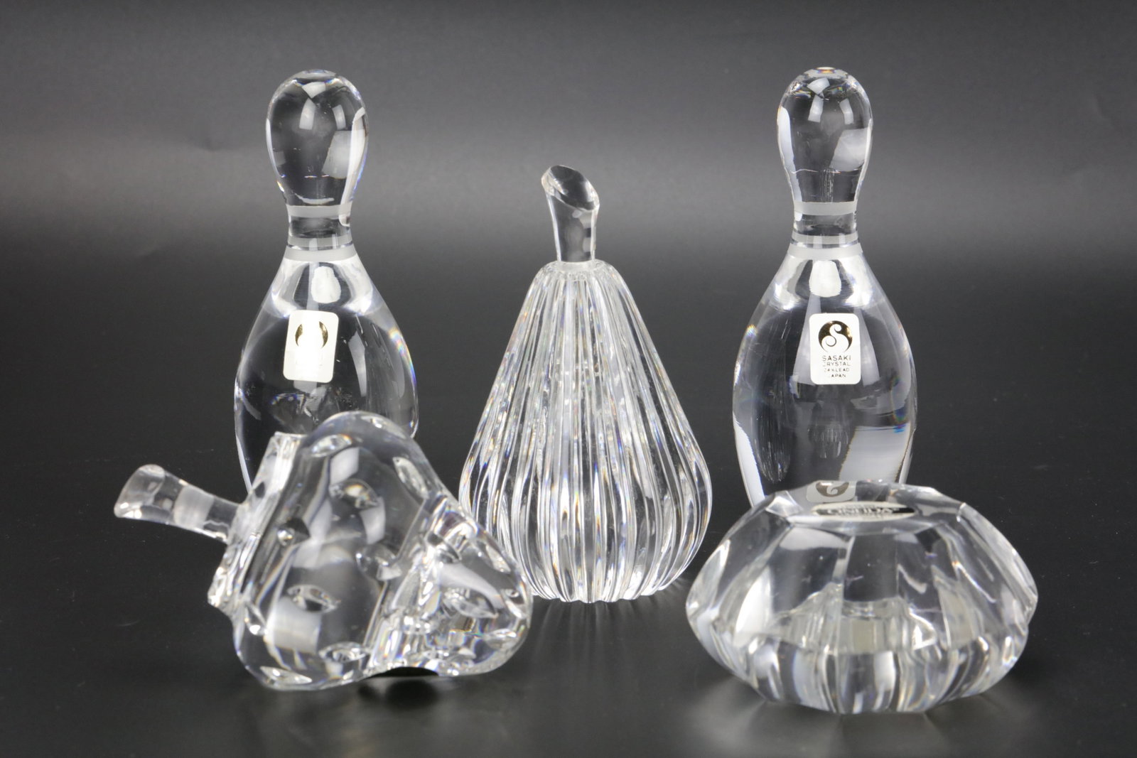 Lot of Five Vintage Crystal Pieces: Lot of Five Vintage Crystal Pieces: Sasaki Japan Bowling Pin Figurines, Waterford Fruit Form Sculptures, Spheres and Faceted Art Glass.?Bowling Pin H 13 cm(5 in.). Preview from Aug 24th to 28th from 1