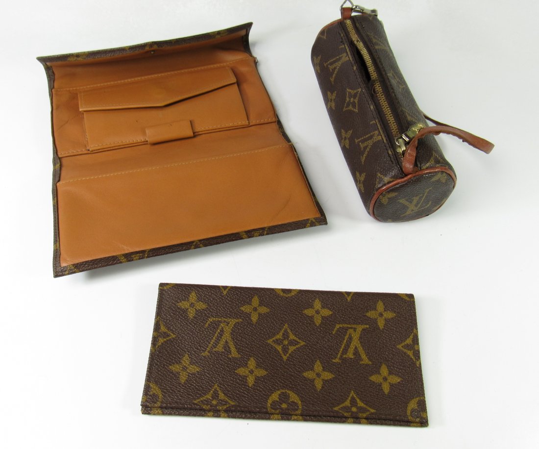 Pair of Louis Vuitton Wallets: Pair of Louis Vuitton Wallets. Worn to Fair Condition. Wallet Measures 7-1/8" Length x 4-18" Wide. Tube 6-1/4" Length x 2-/2" Diameter.