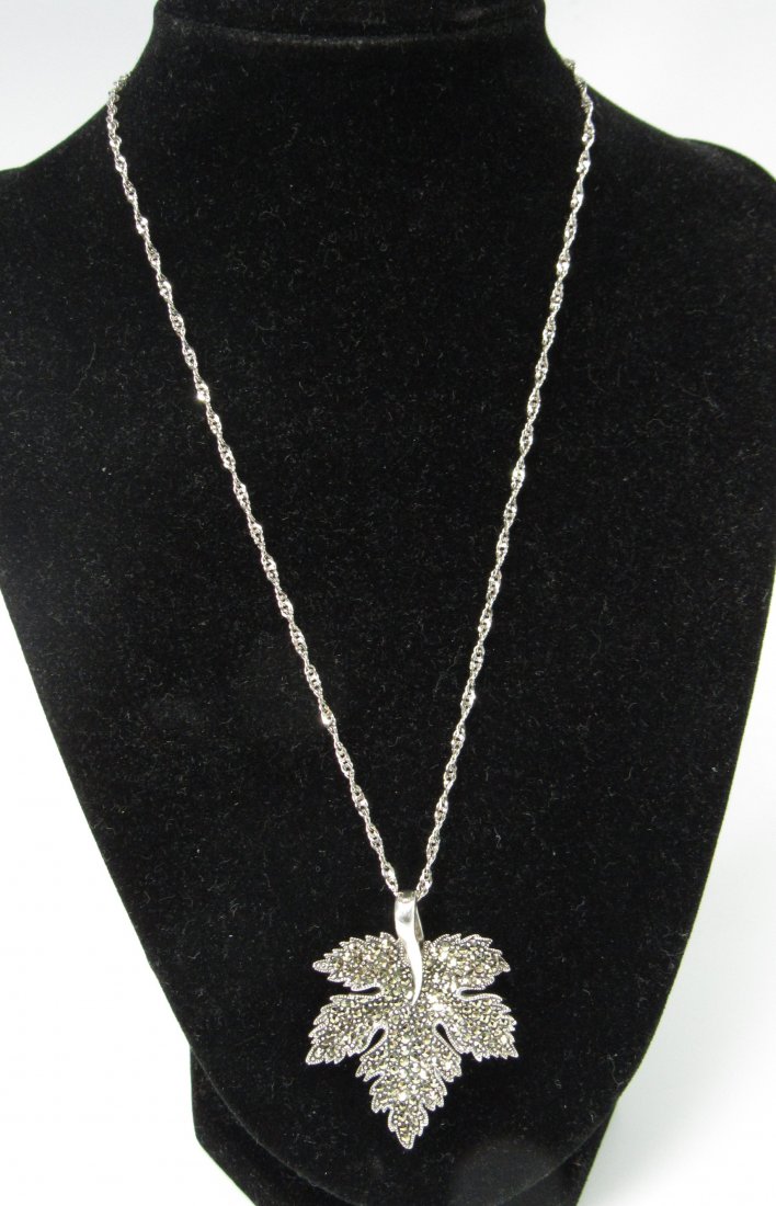 925 Sterling Silver Marcasite Leaf Enhancer on Chain: 925 Sterling Silver Marcasite Leaf Enhancer on Chain. Marked 925. Pendant Measures 1-7/8" Long x 1-3/8" Wide on 8-1/4" Chain. Total Weight 13.7Grams.