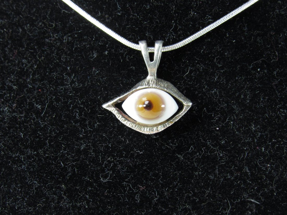 Sterling Silver Hazel Glass Eye Pendant on/Chain: Sterling Silver Hazel Glass Eye Pendant on Sterling Silver Chain. Good Condition. Measures Pendant 7/8" Long x 7/8" Wide, Chain 11-7/8" Long. Total Weight 8.7 Grams.