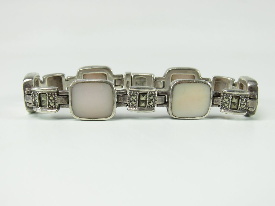 Sterling Silver Mother of Pearl & Marcasite Bracelet: Sterling Silver Mother of Pearl & Marcasite Bracelet. Good Condition. Measures 7-1/4" Long. Total Weight 33.6 Grams.