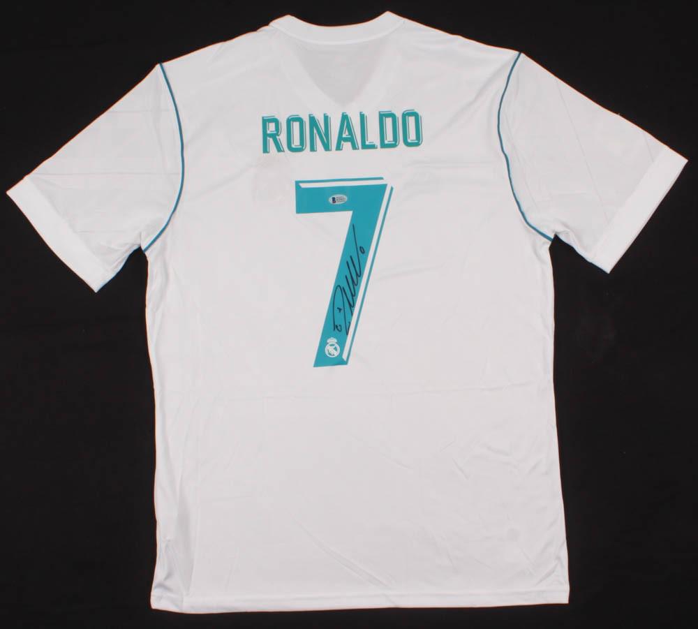 Cristiano Ronaldo Signed Real Madrid Jersey: Adidas on-field style jersey. Everything is printed on, size XL. Hand-signed by Cristiano Ronaldo.The lot / autograph(s) includes an official Beckett Authentication Services serially numbered hologram