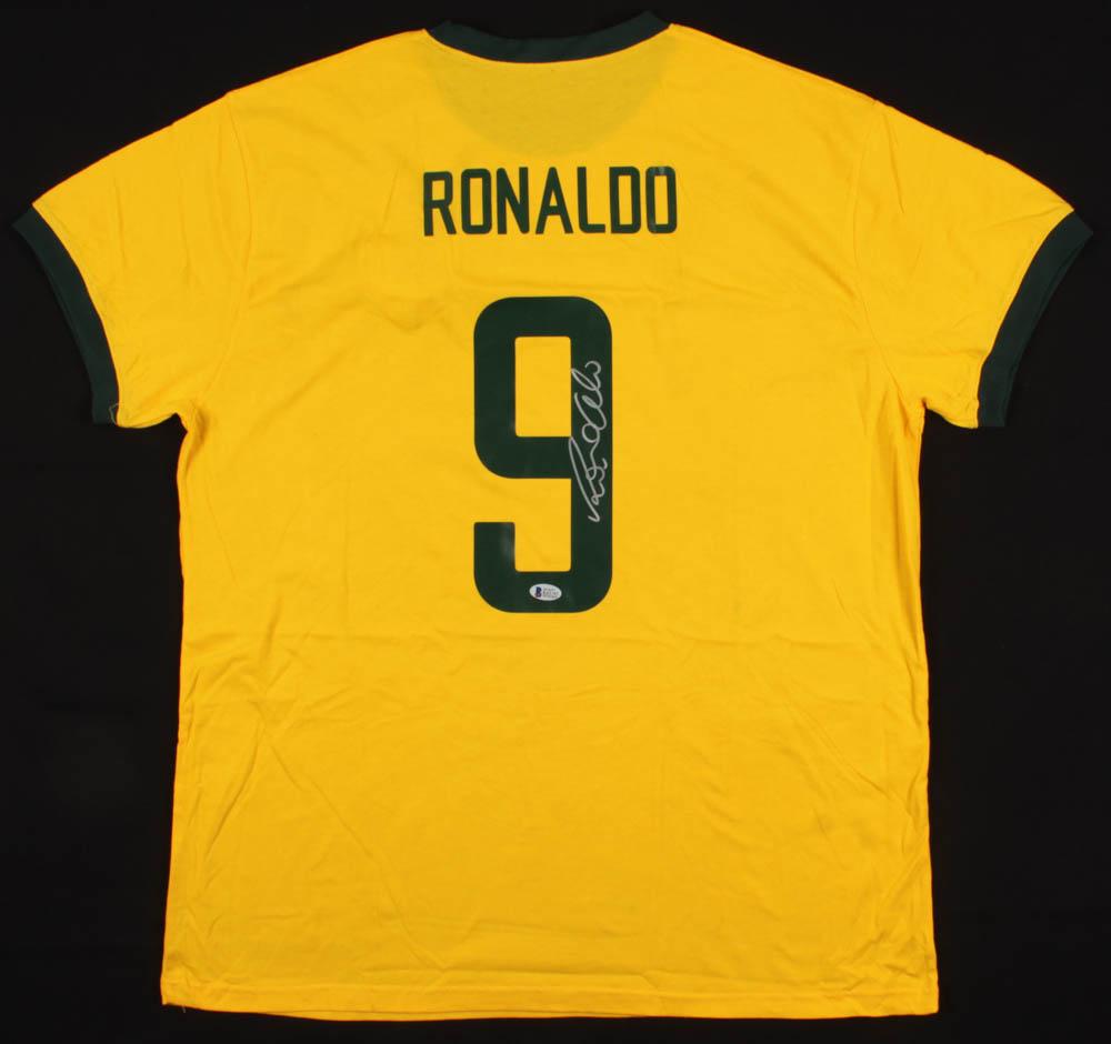 Ronaldo Signed Jersey: Custom on-field style jersey. Everything is printed on, size XL. Has been hand-signed in silver paint pen by Ronaldo. The lot / autograph(s) includes an official Beckett Authentication Services serial