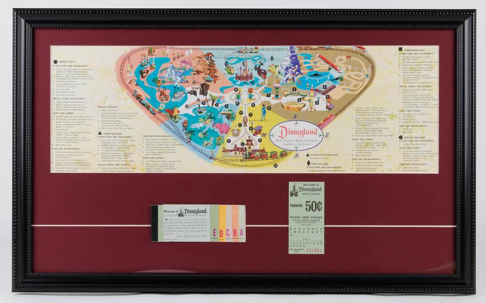 Disneyland 16x26 Custom Framed Vintage 1963 Magic: Custom frame measures 16" x 26" in size and features a map print of Walt Disney's Magic Kingdom. Display also features a vintage Magic Kingdom ticket book and a 50 cent parking pass.