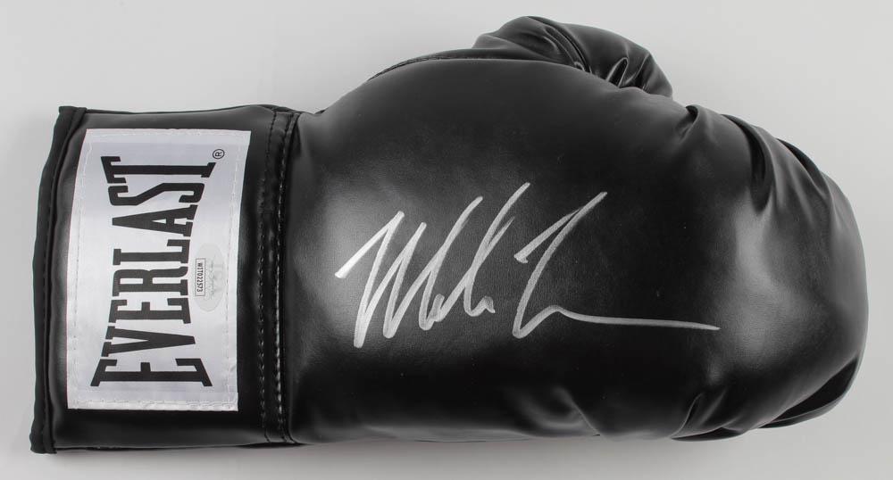 Mike Tyson Signed Everlast Boxing Glove (JSA COA): Everlast boxing glove has been hand-signed by Mike Tyson (HOF).The lot / autograph(s) includes an official James Spence Authentication (JSA) hologram and matching COA for authenticity purposes. The si