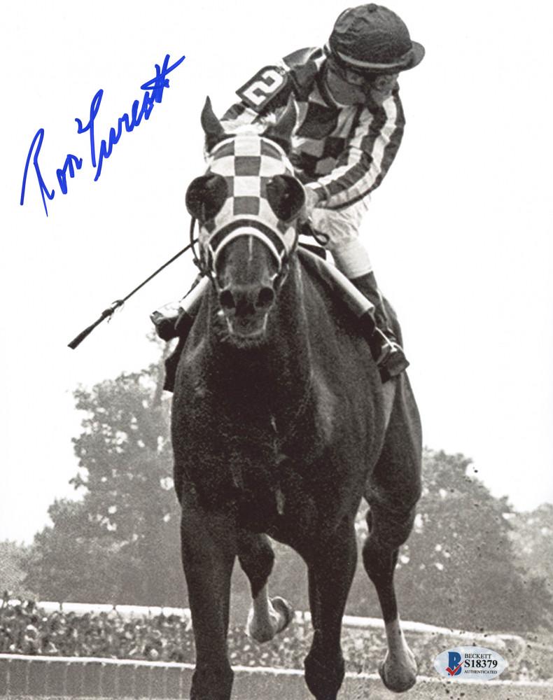 Ron Turcotte Signed Secretariat 8x10 Photo (Beckett: Photo measures 8" x 10" in size and has been hand signed by Ron Turcotte. The lot / autograph(s) includes an official Beckett Authentication Services serially numbered hologram and matching COA for au