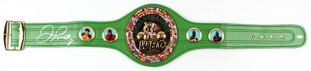 Floyd Mayweather Jr. Signed Full-Size WBC Heavyweight: Full-size replica WBC Heavyweight Championship belt has been hand-signed by Floyd Mayweather Jr. The belt includes thick metal plates and faux leather. The lot / autograph(s) includes an official Beck