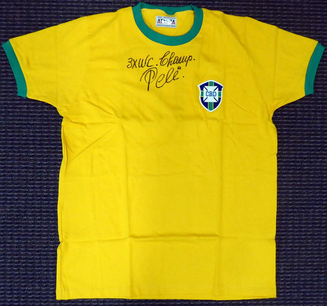 CBD Brazil Pele Autographed Yellow Athleta Short Sleeve: This is an Athleta CBD Brazil Jersey that has been hand signed by Pele. This item has been certified authentic by Beckett (BAS) and comes with their tamper-proof sticker and matching certificate of au