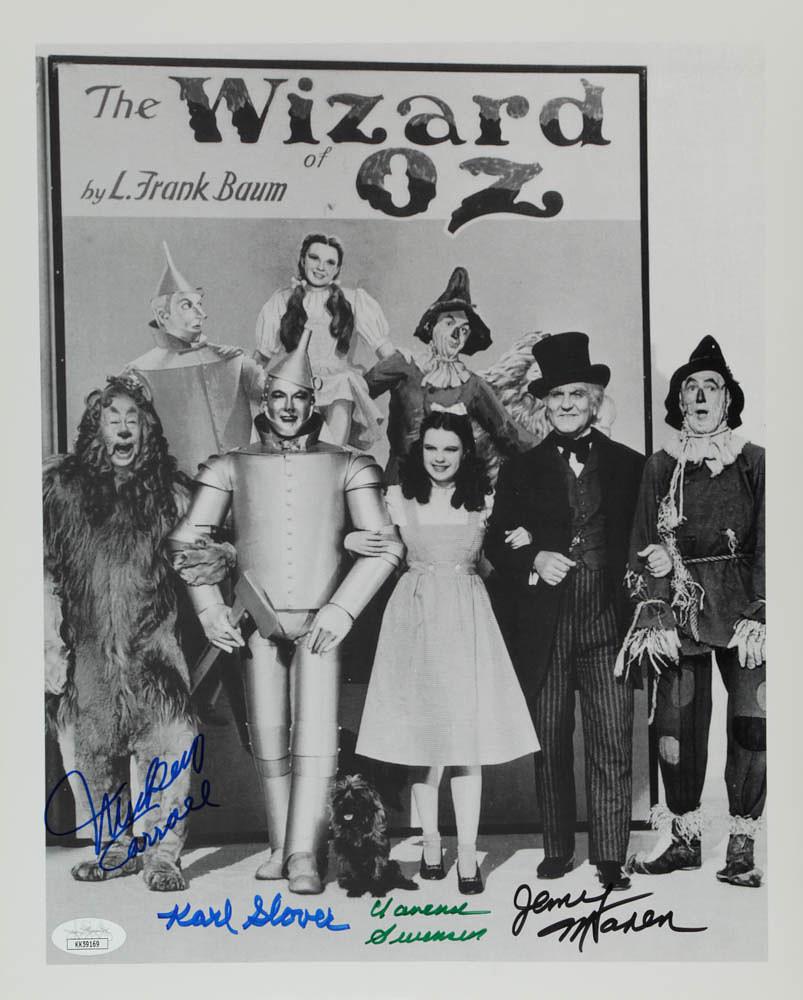 "The Wizard Of Oz" 11x14 Photo Cast-Signed by (4) with: Photo measures approximately 11" x 14" in size and has been hand-signed by (4) including Mickey Carroll (D. 2009), Jerry Maren (D.2018), Clarence Swanson, Karl Slover (D. 2011).The lot / autograph(s)