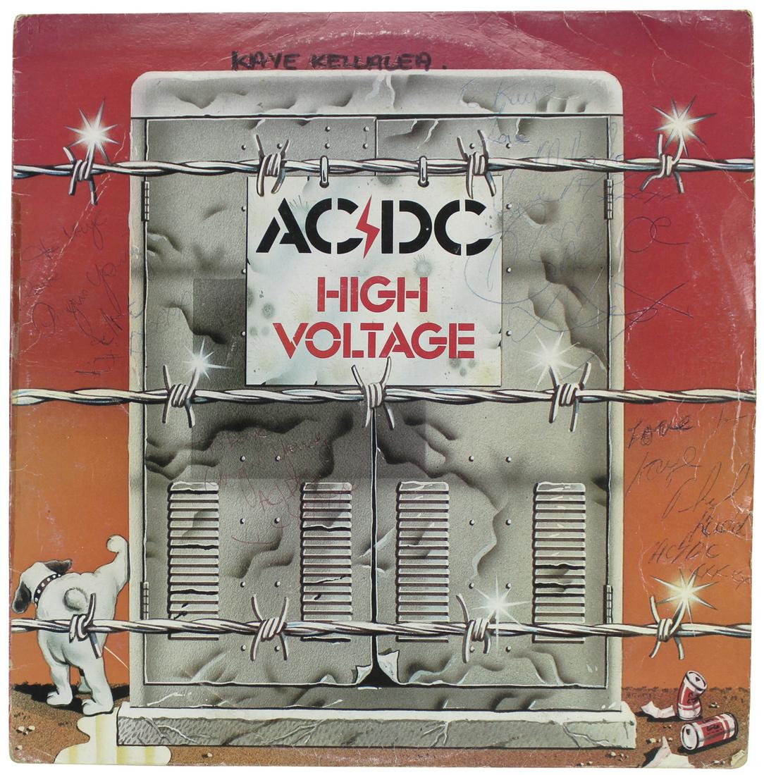 AC/DC (4) Scott, Angus, Malcolm & Rudd Signed High: This Autographed High Voltage Album Cover W/ Vinyl has been Personally Signed by Bon Scott, Angus Young, Malcolm Young & Phil Rudd of AC/DC. This item is 100% Authentic to include a Certificate of Aut