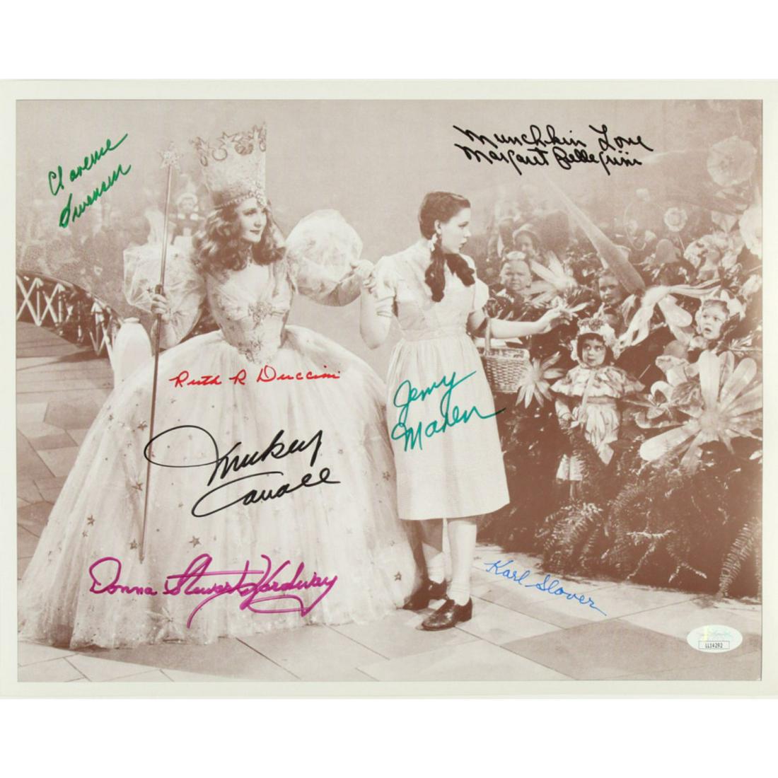"The Wizard Of Oz" 11x14 Photo Cast-Signed by (7) with: Photo measures approximately 11" x 14" in size and has been hand-signed by (7) including Jerry Maren, Donna Stewart-Hardaway, Karl Slover, Clarence Swensen, Margaret Pellegrini, and Ruth Duccini.The l