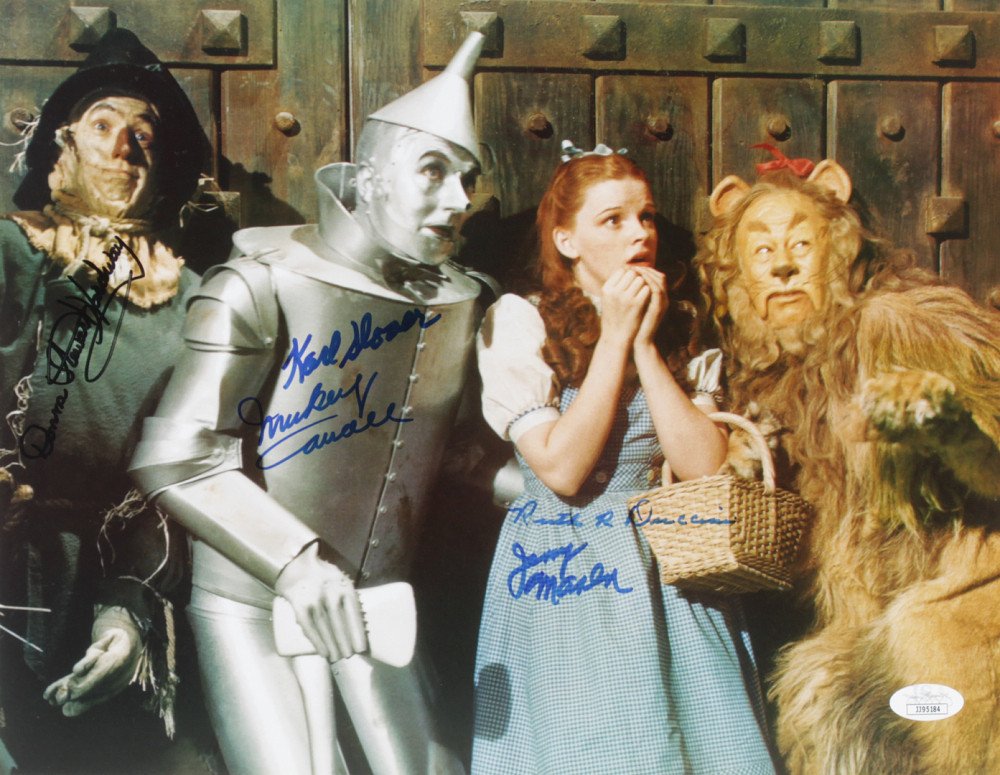 "The Wizard of Oz" 11x14 Photo Cast-Signed by (5) with: Photo measures 11" x 14" in size and has been hand-signed by Karl Slover (D. 2011), Mickey Carroll (D. 2009), Jerry Maren (D. 2018), Ruth Duccini (D. 2014), and Donna Stewart-Hardaway (D. 2008).The lo